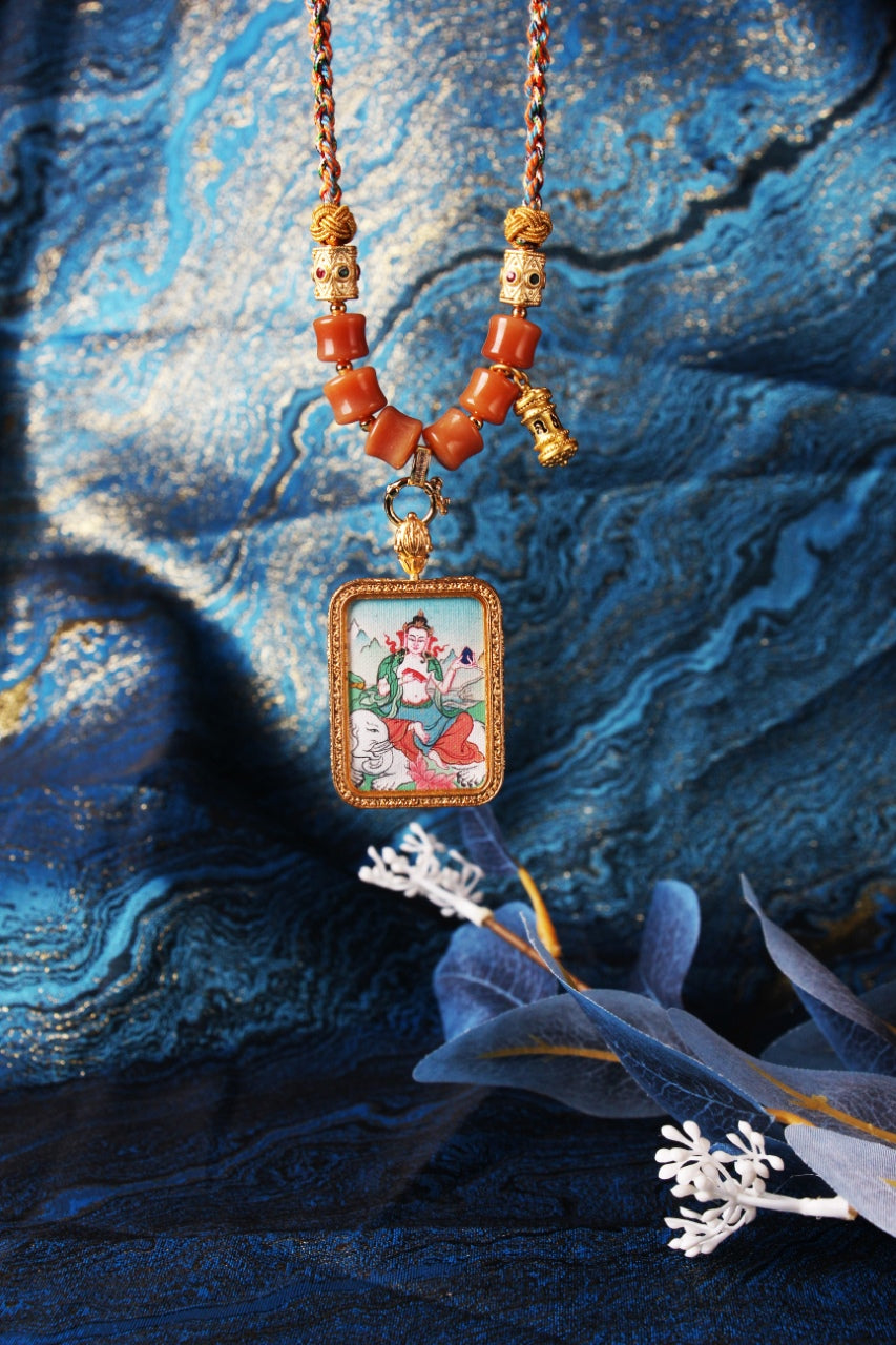 The Karma Kagyu Samantabhadra Thangka pendant displayed as a sacred amulet for virtue and merit, embodying the universal virtue of Tibetan Buddhist tradition.
