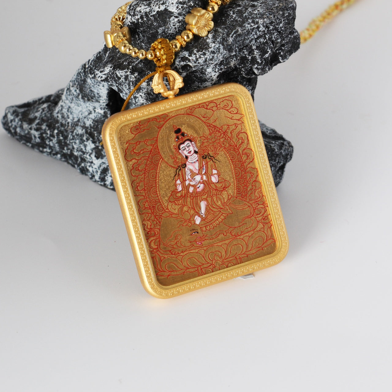 The Karma Kagyu Samantabhadra Thangka pendant displayed as a sacred amulet for virtue and practice, embodying Tibetan Buddhist tradition.
