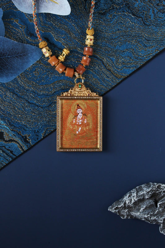  The Rebgong Samantabhadra Thangka pendant displayed as a sacred amulet for virtue and merit, embodying the universal virtue of Tibetan Buddhist tradition