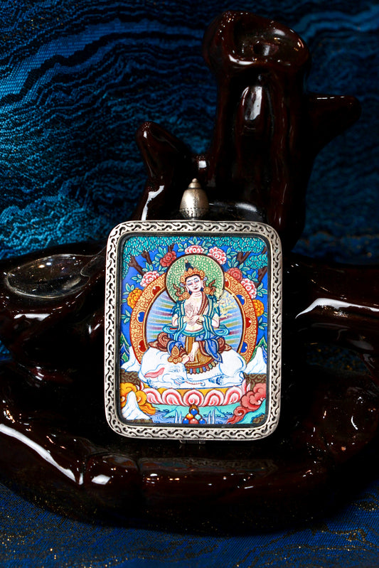A sacred hand-painted Samantabhadra Bodhisattva Thangka pendant from Regong, featuring the Bodhisattva of Universal Virtue on a white elephant in a fine silver frame.