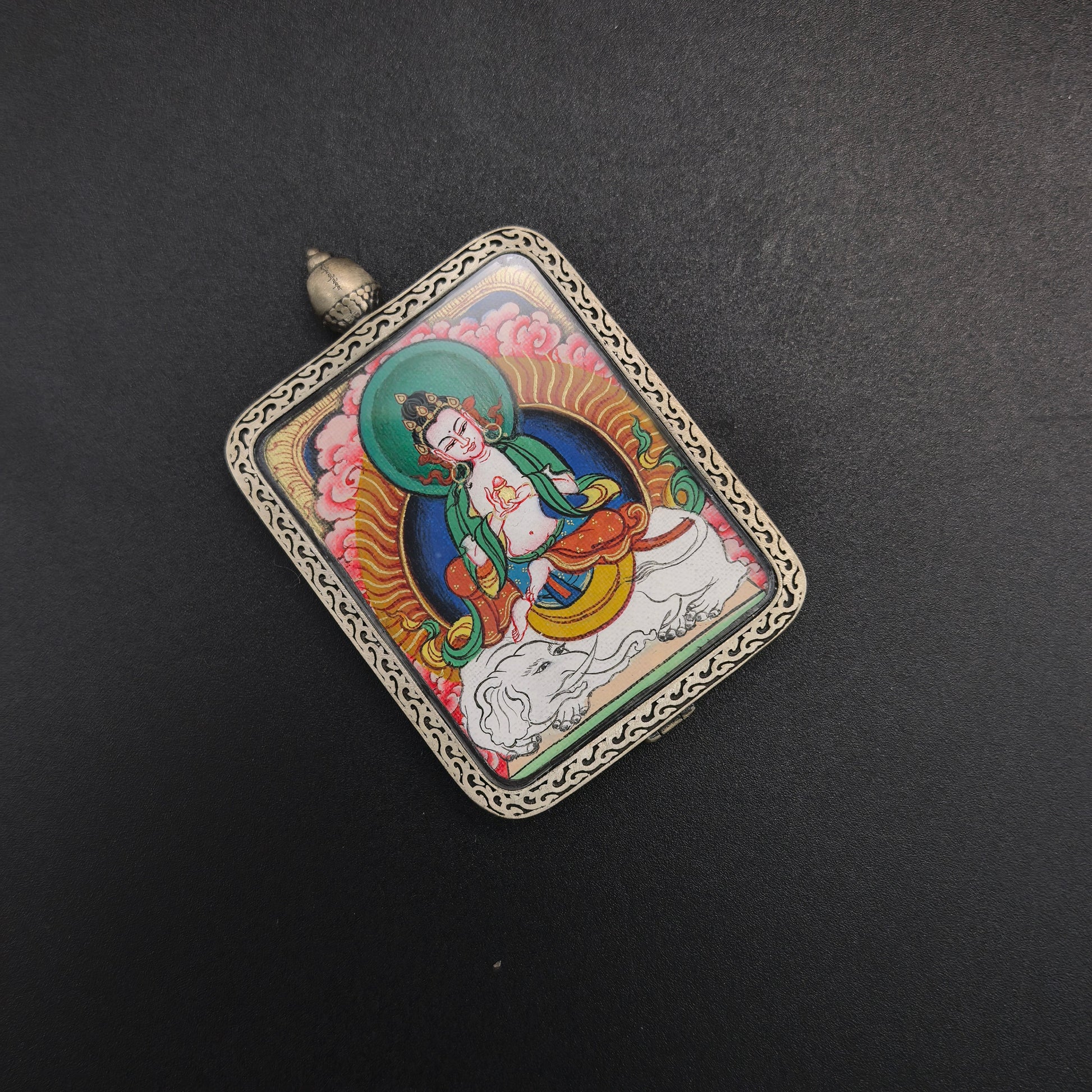 The Tibet Red Cloud Samantabhadra Thangka pendant with 925 silver displayed as a sacred amulet for virtue and truth, embodying Buddhist tradition.

