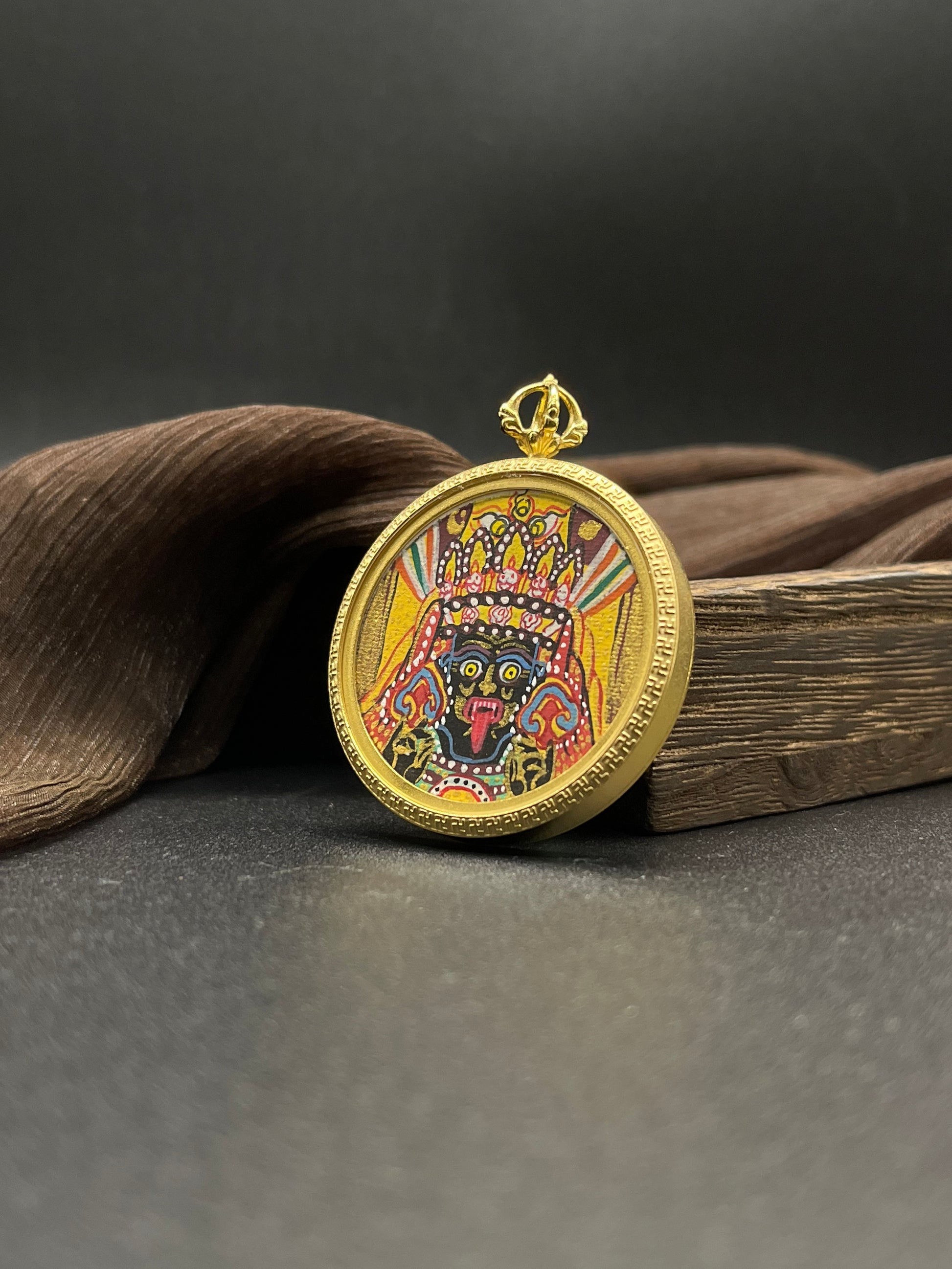 Detailed view of the Ten Auspicious Signs titanium casing for the Shachilama Thangka pendant, symbolising wealth and tradition in Buddhist practice.
