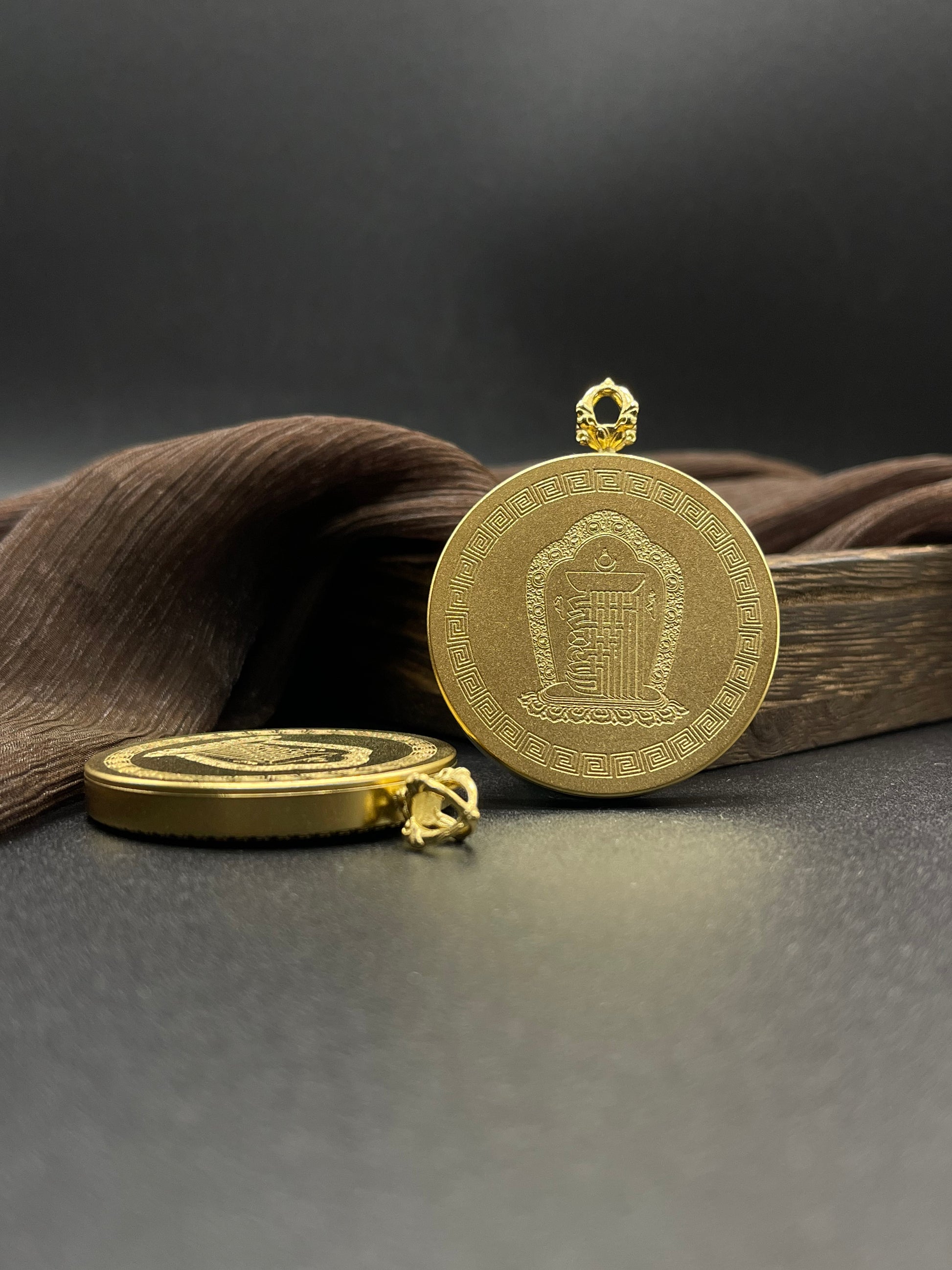 The Nepal Shachilama Thangka pendant with Ten Auspicious Signs titanium casing displayed as a sacred amulet for wealth and peace, embodying Buddhist tradition.

