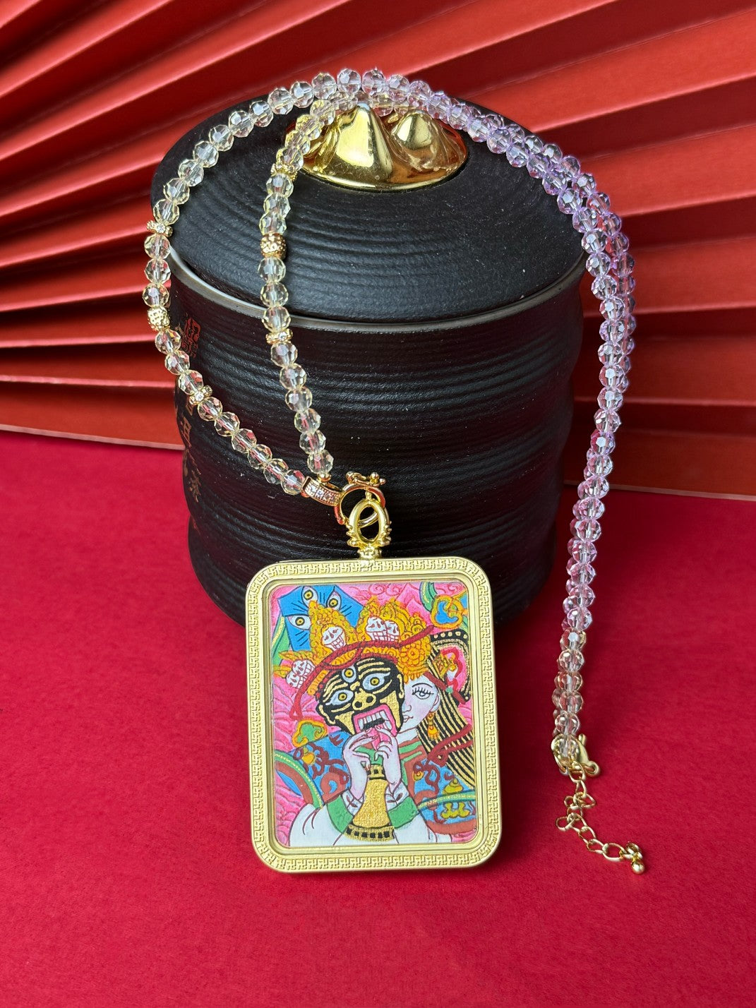 Detailed view of the refined copper casing for the Shachilama Past and Present Thangka pendant, symbolising perseverance and tradition in Buddhist practice.
