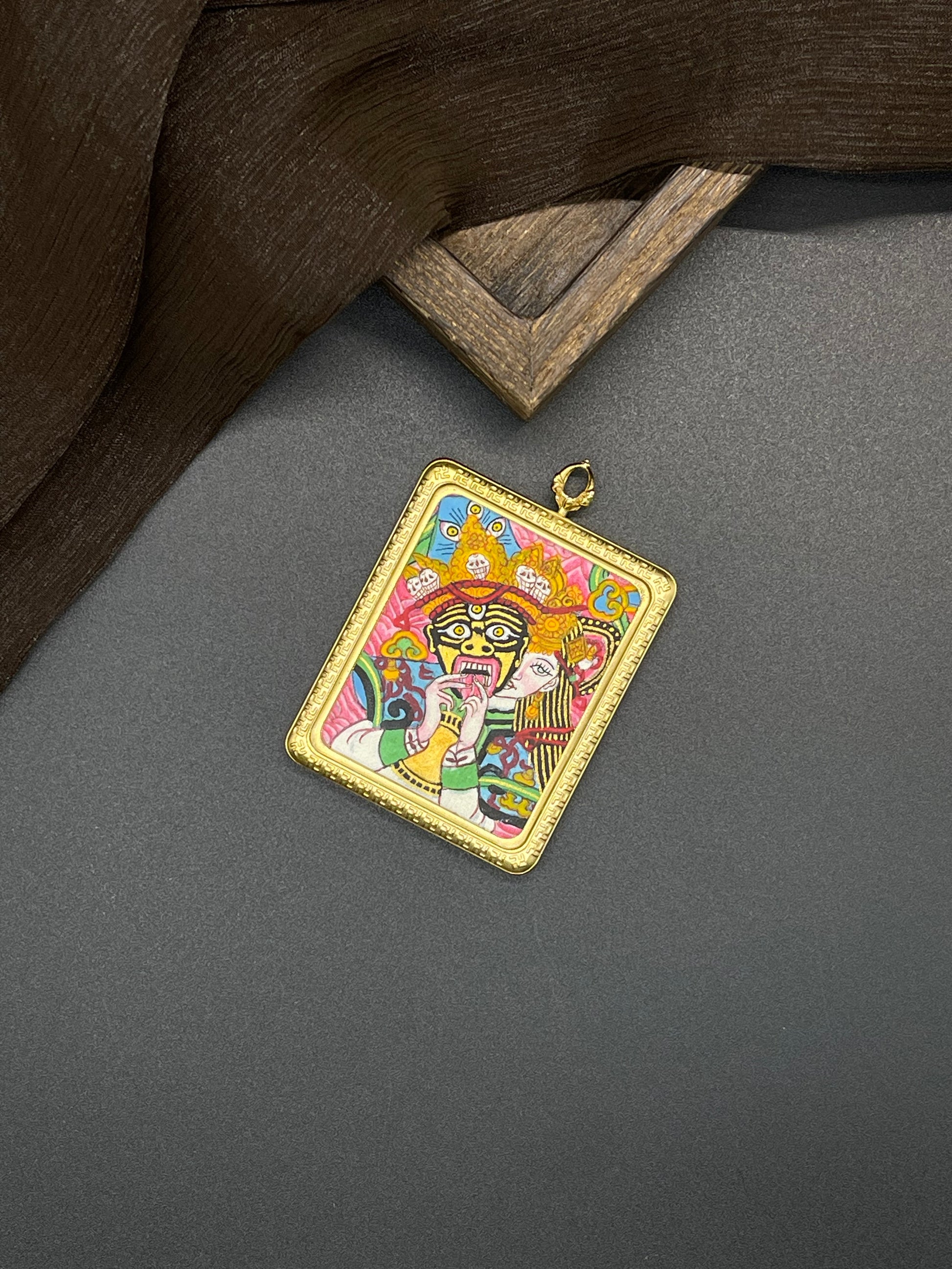 Hand-painted Nepal Shachilama Pink Past and Present (扎基拉姆前世今生) Thangka pendant 4x5cm with titanium casing, representing unyielding courage and the bestowal of harvest and fortune in Buddhist tradition.
