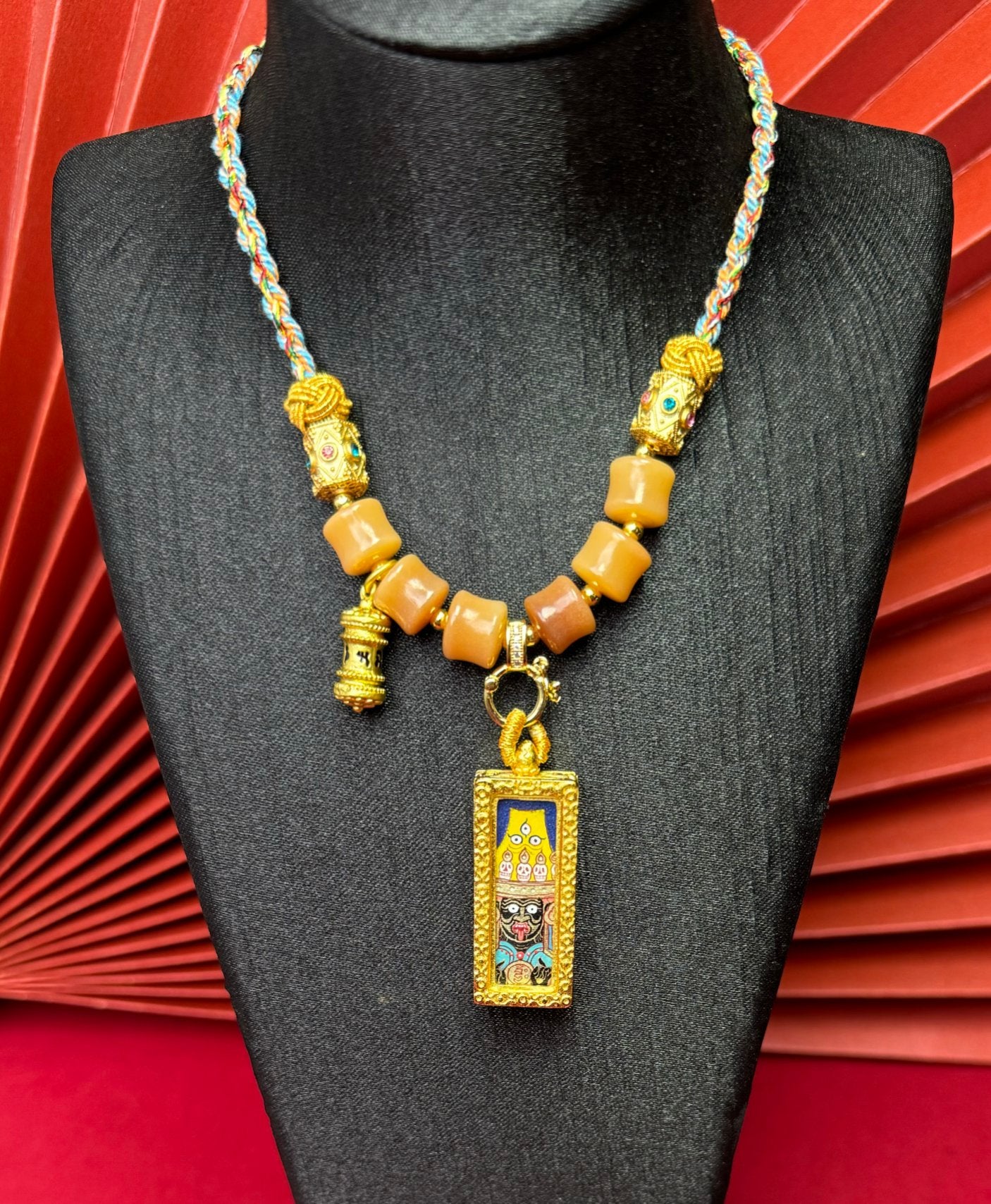  Close-up detail of the Rekong Shachilama Thangka showing hand-painted mineral pigments and lapis, showcasing the masterful artistry and rich texture.
