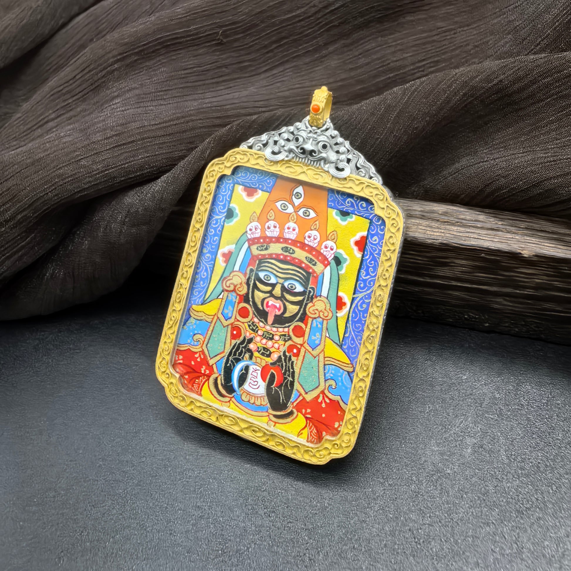 A 3.5x4.5cm hand-painted Rekong Blue Shachilama (蓝底扎基拉姆) Thangka pendant with 925 silver casing featuring the female wealth deity, representing wealth and peace in Buddhist tradition.

