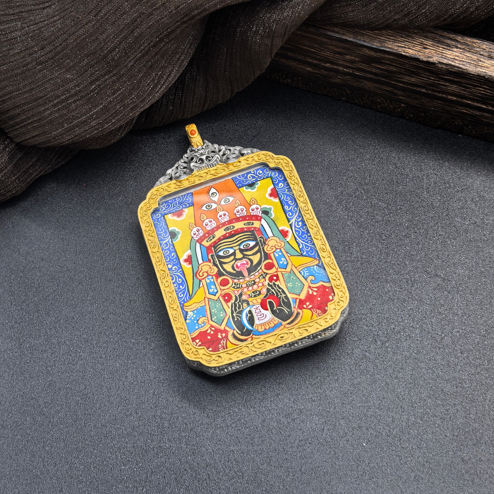  The Rekong Blue Shachilama Thangka pendant with 925 silver casing displayed as a sacred amulet for wealth and peace, embodying Buddhist tradition.
