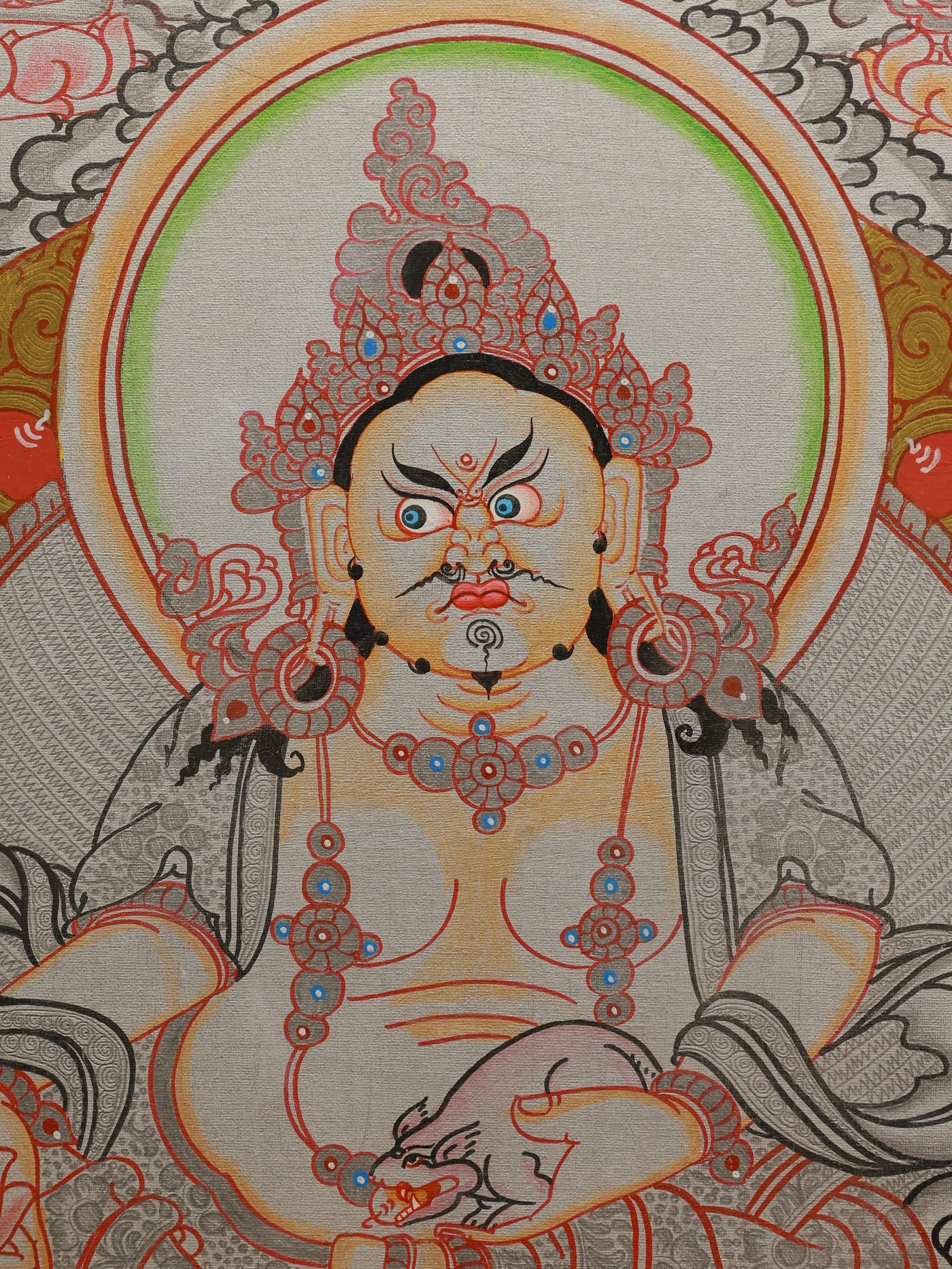Sacred silver thangka artwork featuring Dzambhala, the deity of prosperity in Tibetan Buddhism