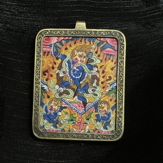 The Nepal Elegant Simhamukha Thangka pendant displayed as a sacred amulet for dispelling obstacles and ignorance, embodying Vajrayana Buddhist tradition.

