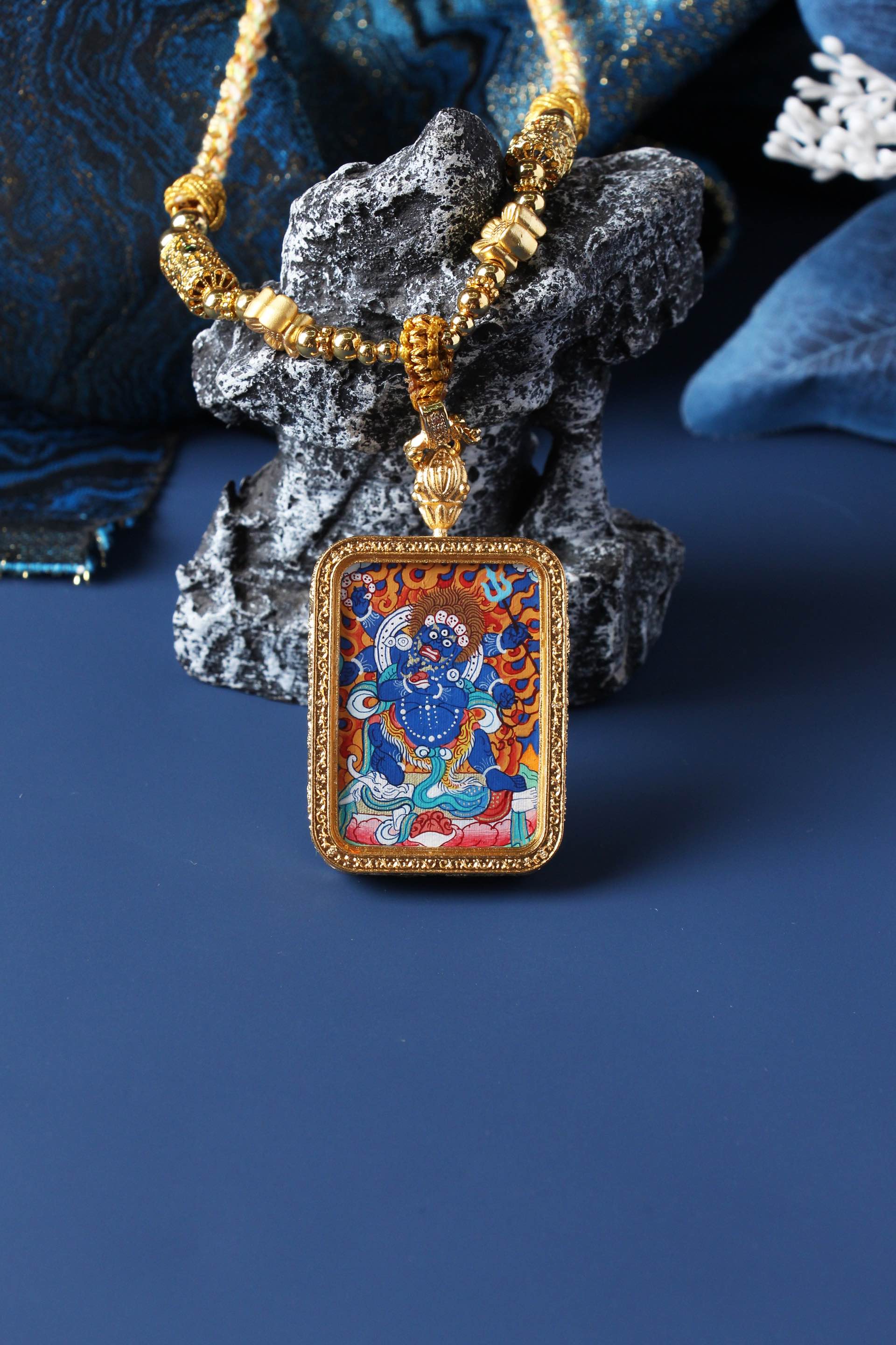  A 3.5x4.5cm hand-painted Tibetan Buddhist Six-Armed Mahakala Thangka pendant featuring the great wrathful protector, encased in exclusive 925 Sterling Silver, representing protection and obstacle removal in Tibetan Buddhist culture.

