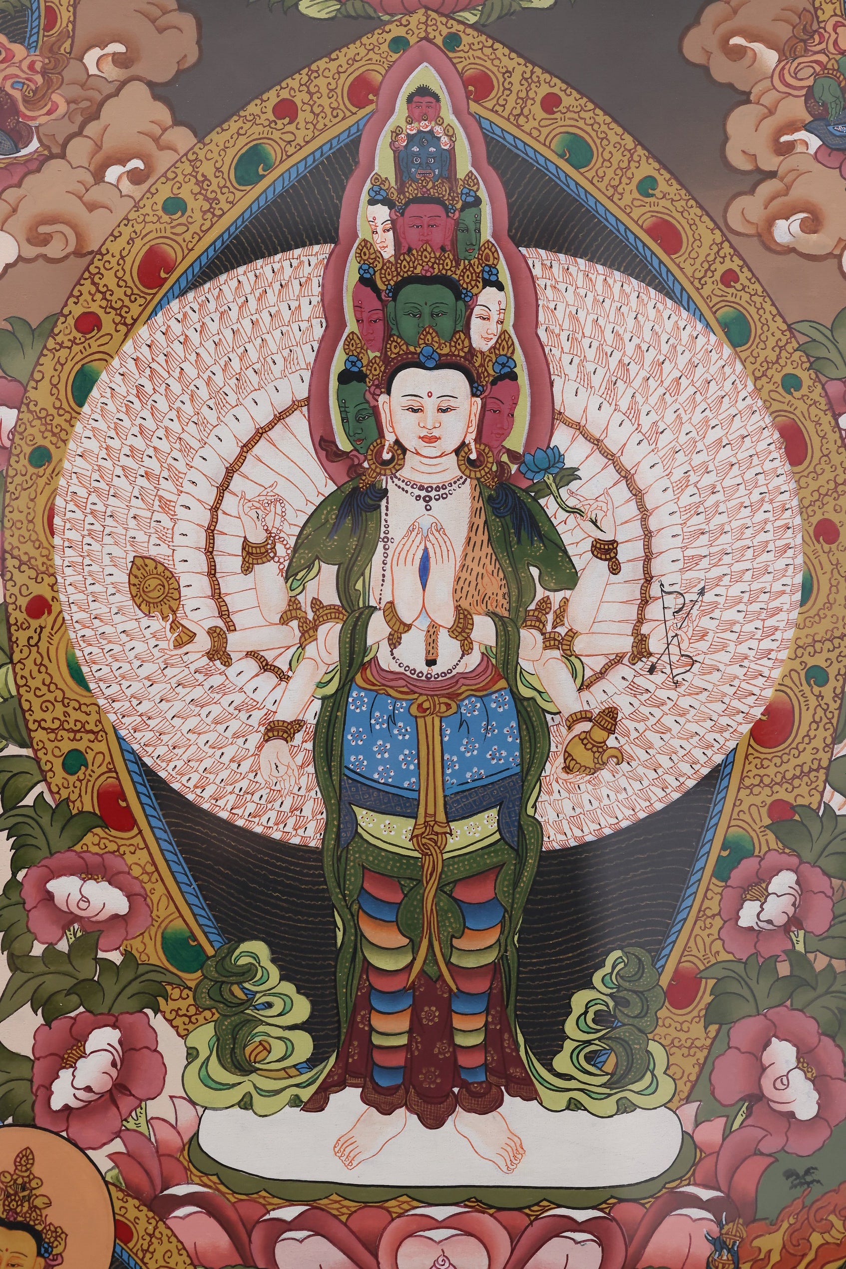 Alt Text: Pure hand-painted Avalokiteshvara Thangka from Tibet, featuring intricate Thousand-Armed design.