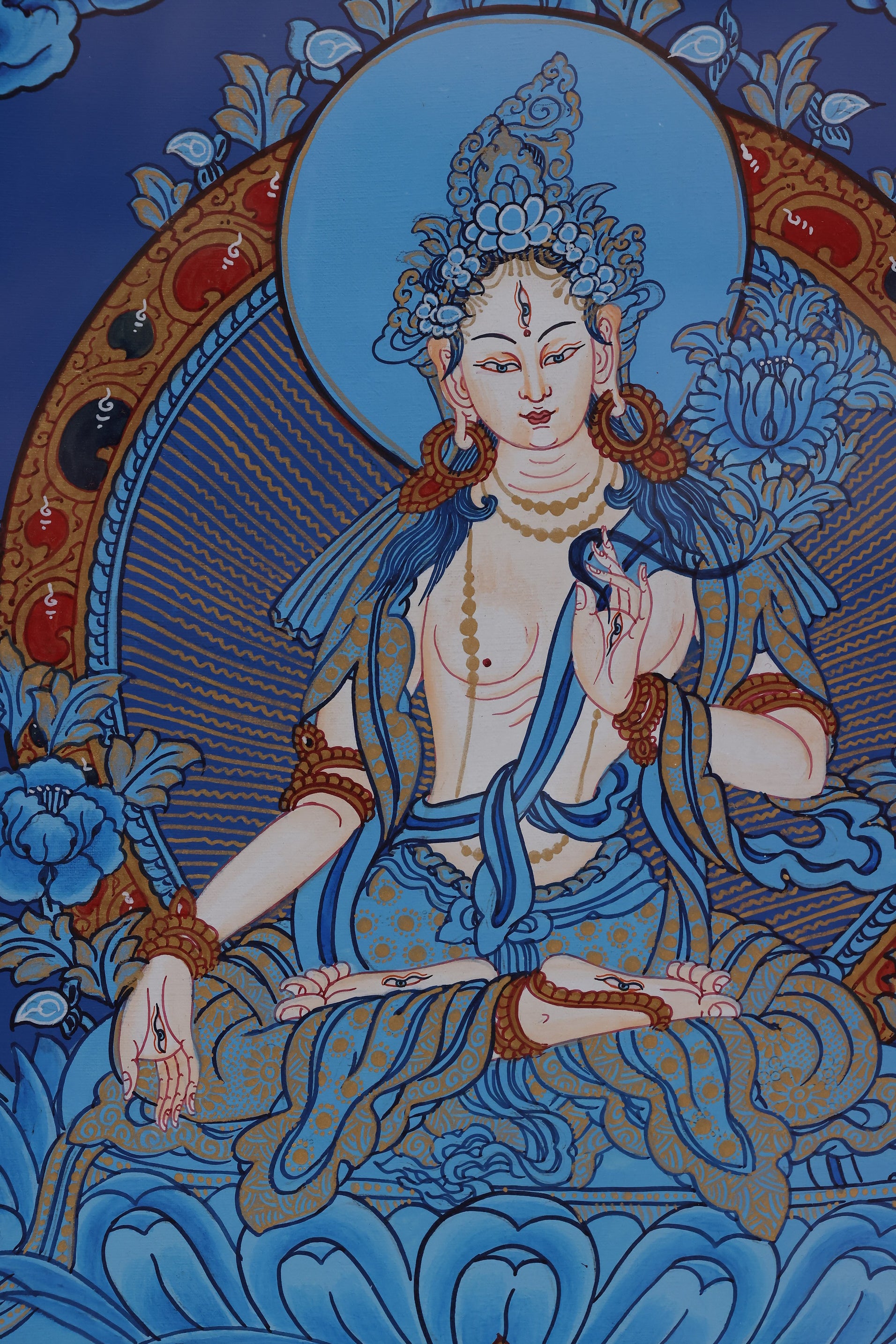 Hand-painted White Tara Blue Thangka created with traditional Tibetan Buddhist techniques and mineral pigments.