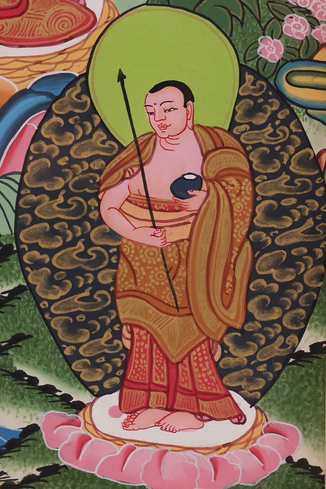 Vivid red and gold Akshobhya Buddha Thangka, combining rich colors with traditional Tibetan artistry.