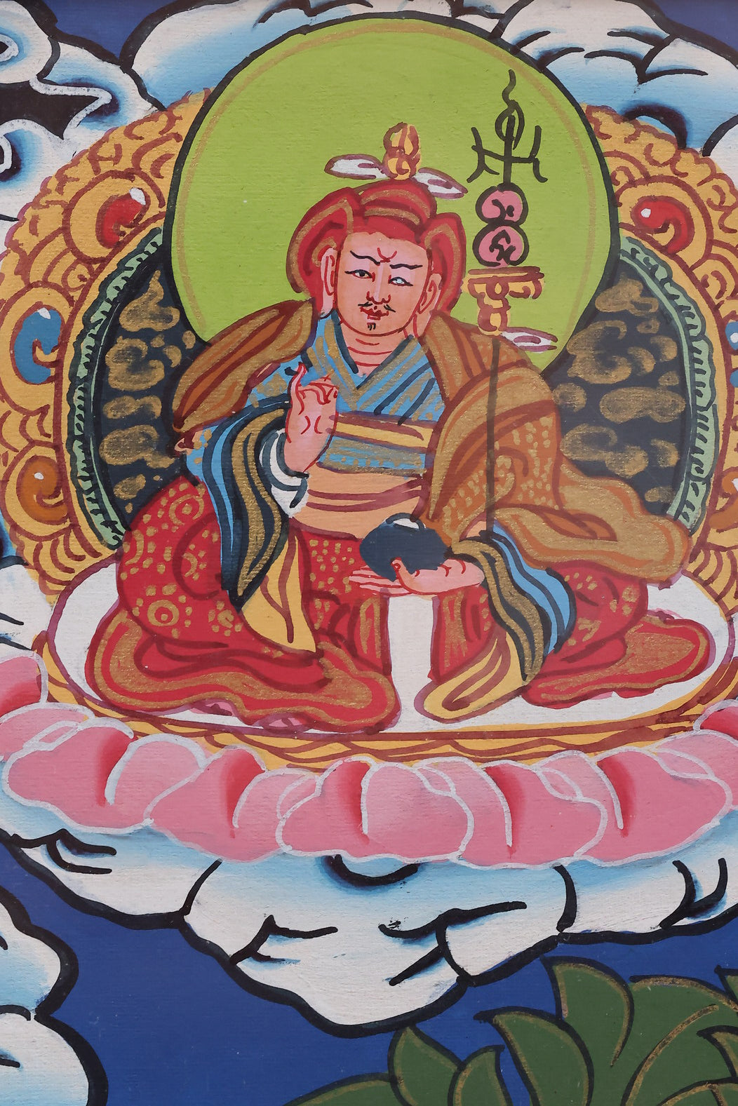 Detailed depiction of Akshobhya Buddha with attendant deities in a classic Tibetan Thangka composition.