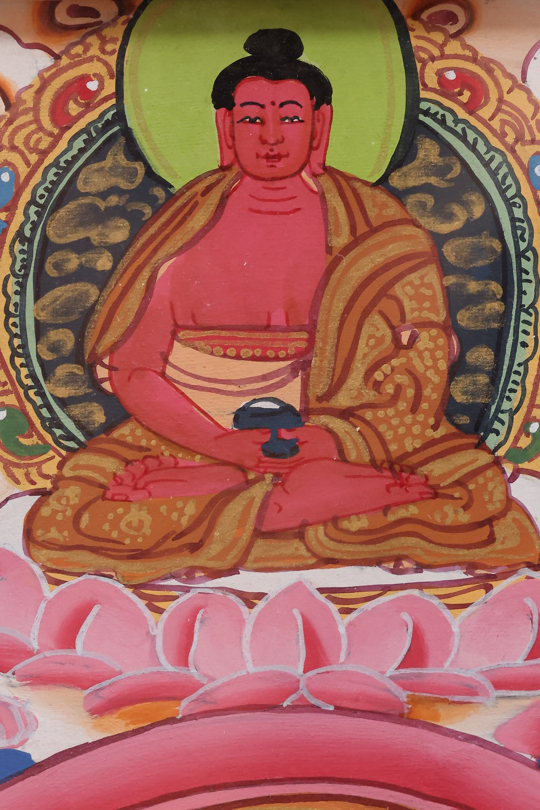 Tibetan Thangka of Akshobhya Buddha holding the Dharma Wheel, representing the eternal flow of Buddhist teachings