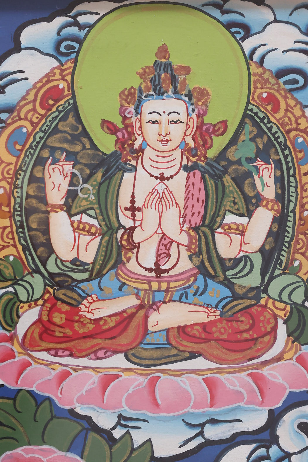 Golden-robed Akshobhya Buddha Thangka, showcasing traditional iconography and sacred symbolism.