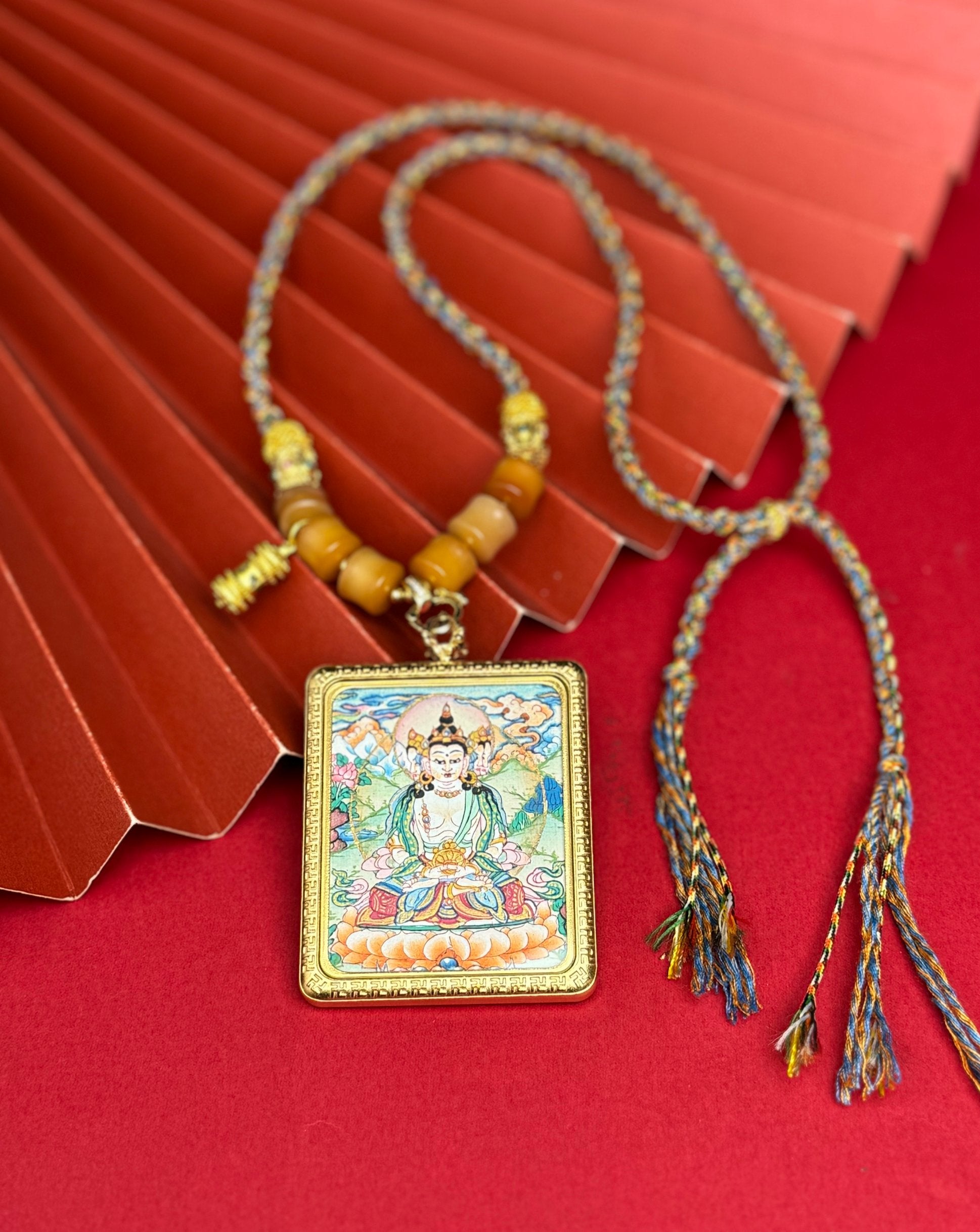  Hand-painted Nepal Vairocana (大日如来) Thangka pendant 4x5cm with titanium casing featuring the Buddha of Cosmic Illumination, representing wisdom and the accomplishment of endeavours in Buddhist tradition.
