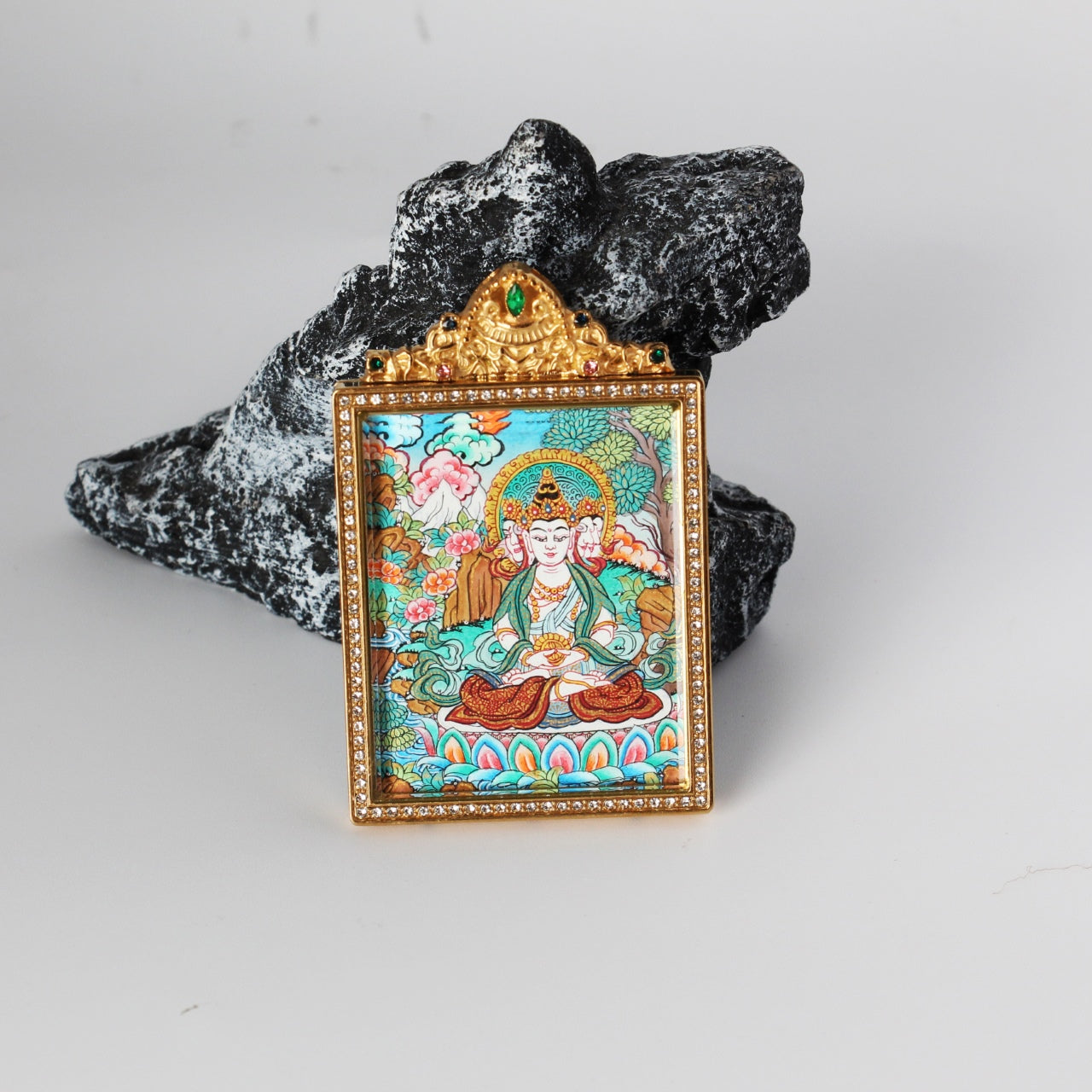 The Nepal Premium Vairocana Thangka pendant displayed as a sacred amulet for wisdom and success, embodying Tibetan Buddhist tradition.


