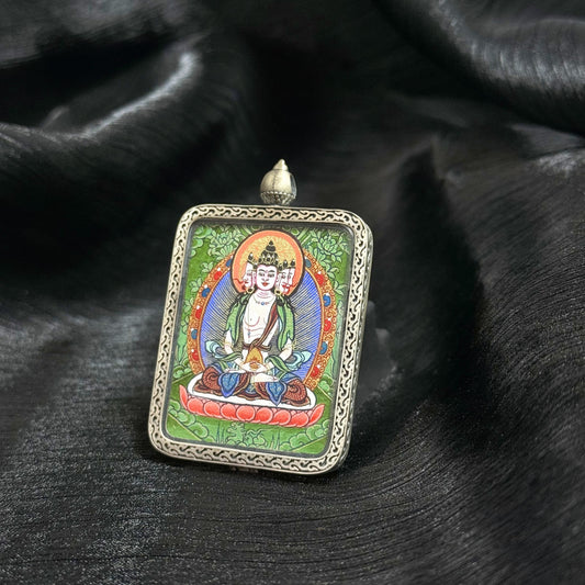 A 3.5x4.5cm hand-painted Rekong Cuiying series Vairocana (Cosmic Buddha) Thangka pendant featuring the Dharmakaya, representing illumination and wisdom in Buddhist tradition.
