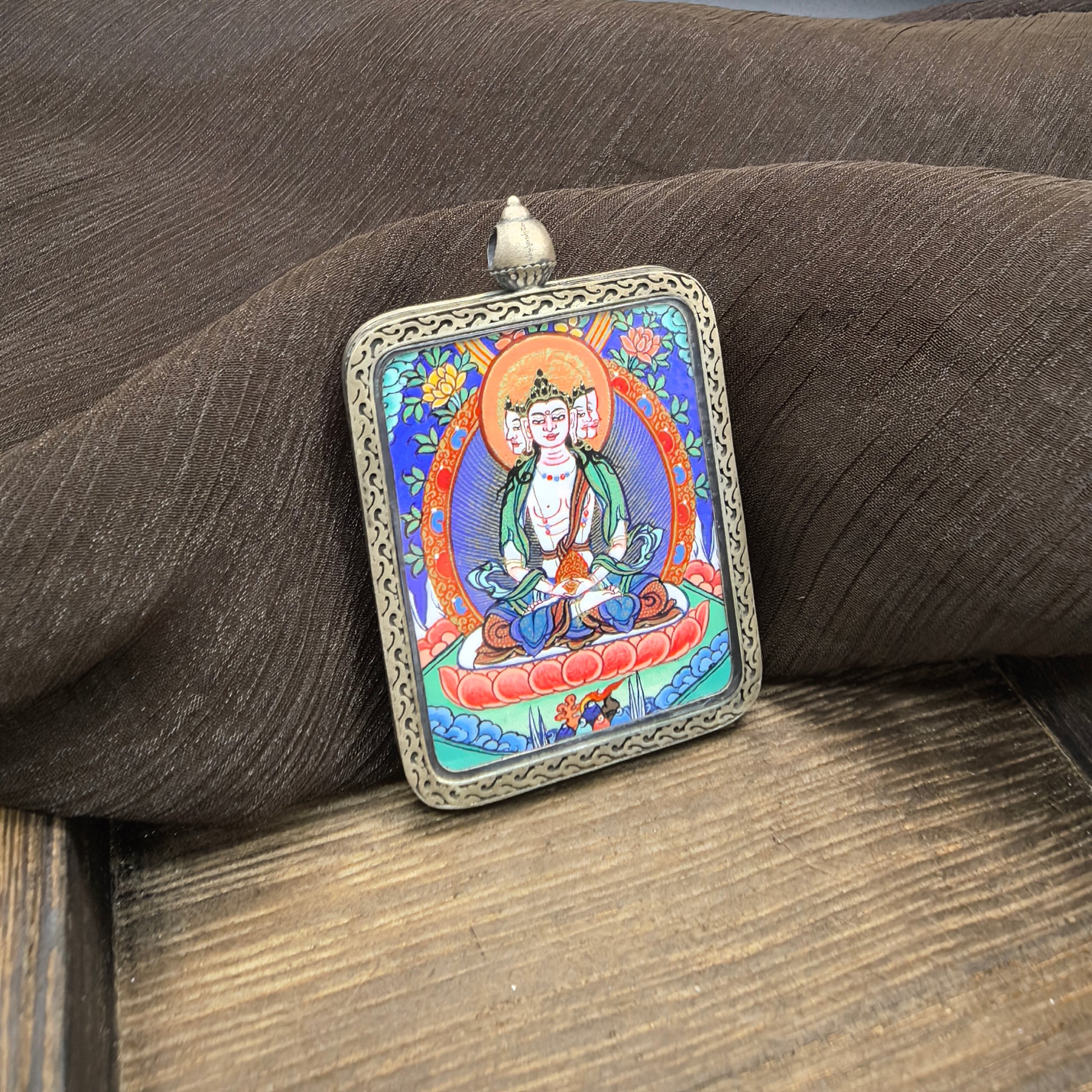  The Rekong Vairocana pendant with 925 silver displayed as a sacred amulet for illumination and success, embodying Buddhist tradition.