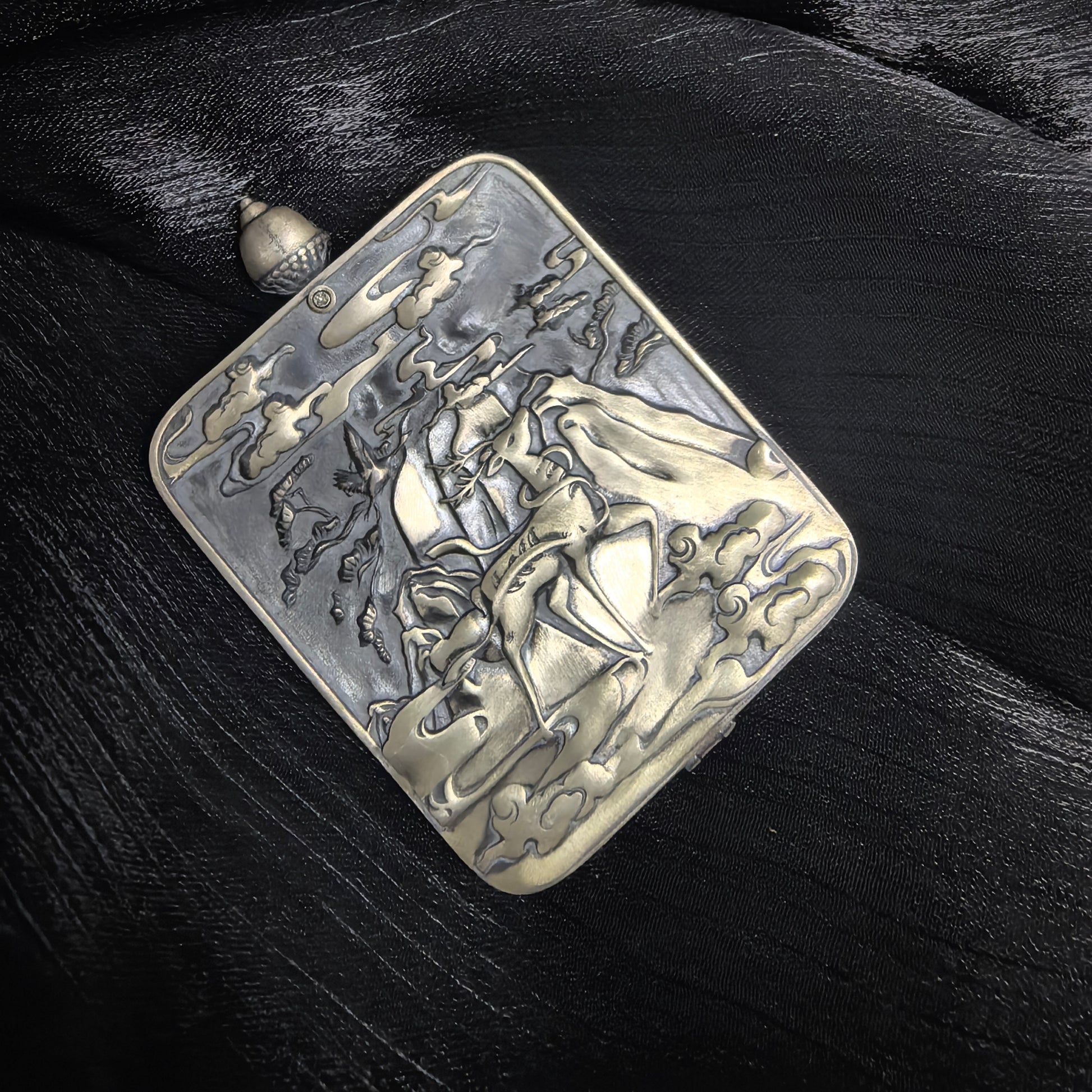  The Rekong Cuiying Vaishravana Thangka pendant displayed as a sacred amulet for wealth and protection.
