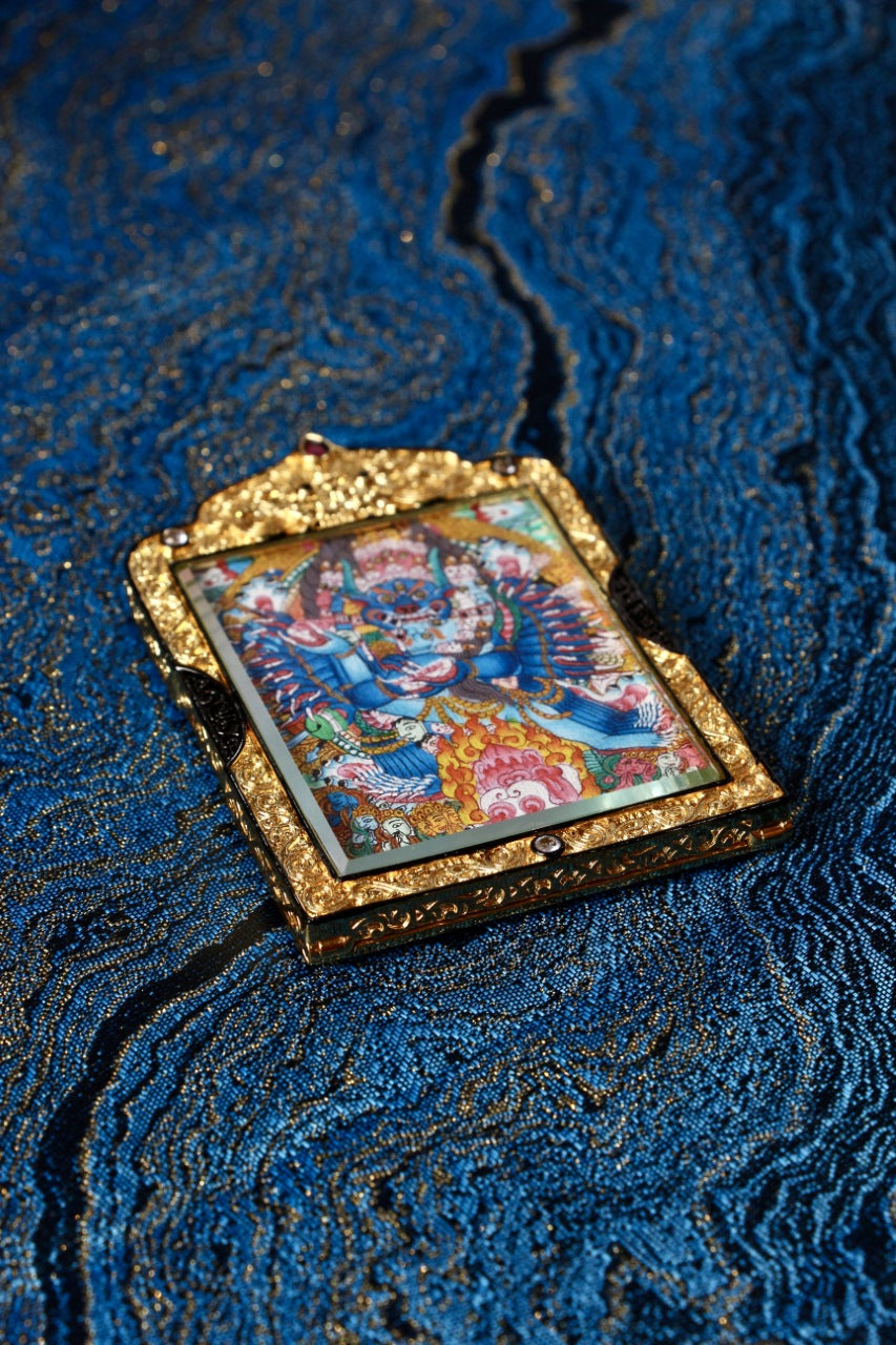 Yamantaka Dharma protector thangka jewelry representing fierce wisdom and compassion in Tibetan Buddhist culture.