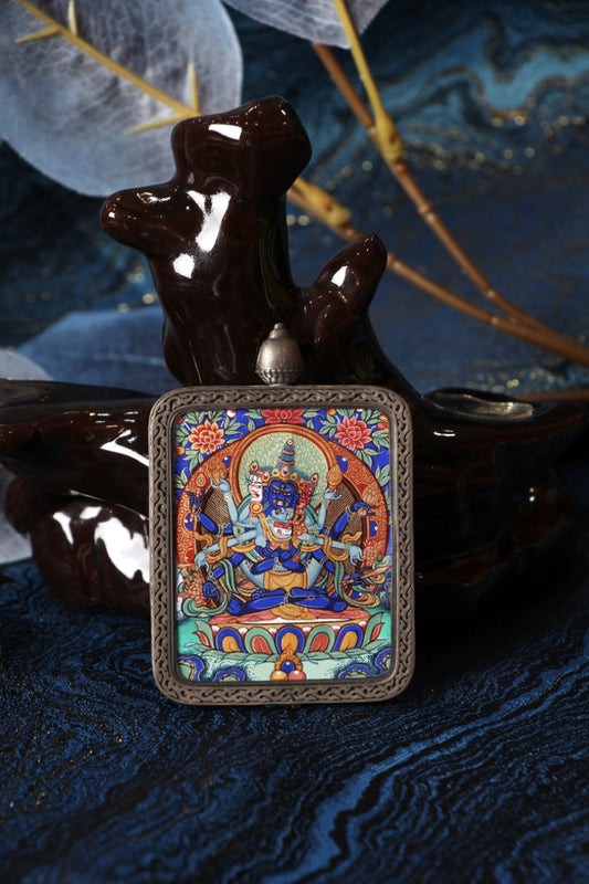 Sacred Tibetan thangka pendant of Vajradhara, associated with Himalayan tantric power, spiritual strength, and enlightenment.