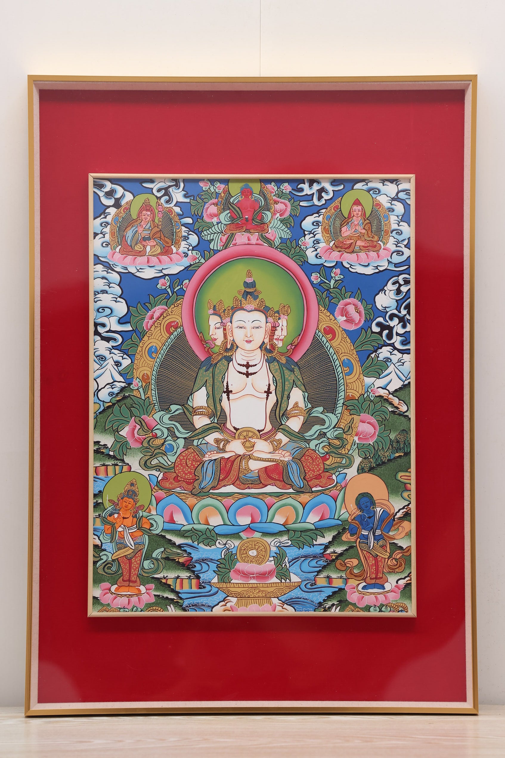 Central deity of the Vajradhatu Mandala depicted with elaborate robes and symbolic hand gestures in a hand-painted thangka.