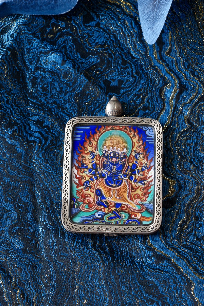 Thangka necklace portraying Vajrakilaya, embodying wrathful energy, spiritual strength, and the removal of hindrances in Tibetan Buddhist practice.