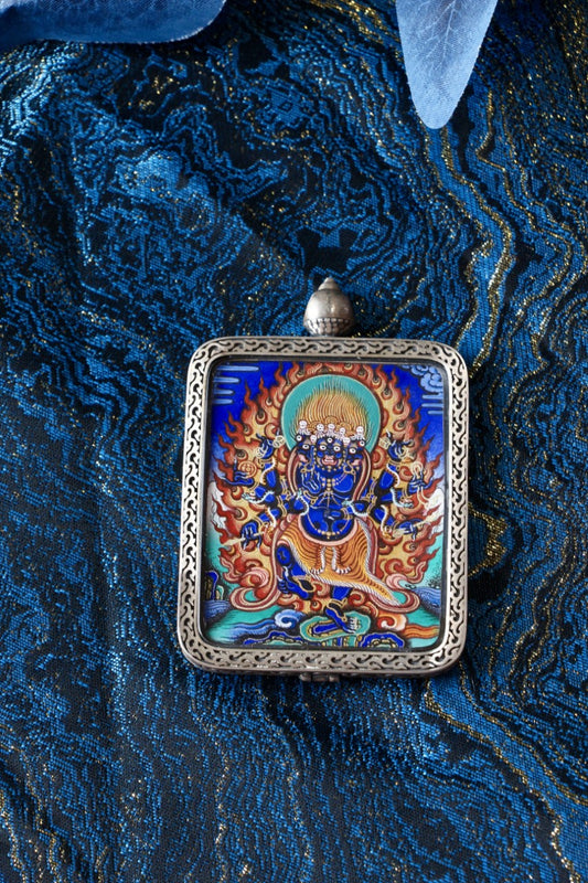Thangka necklace portraying Vajrakilaya, embodying wrathful energy, spiritual strength, and the removal of hindrances in Tibetan Buddhist practice.