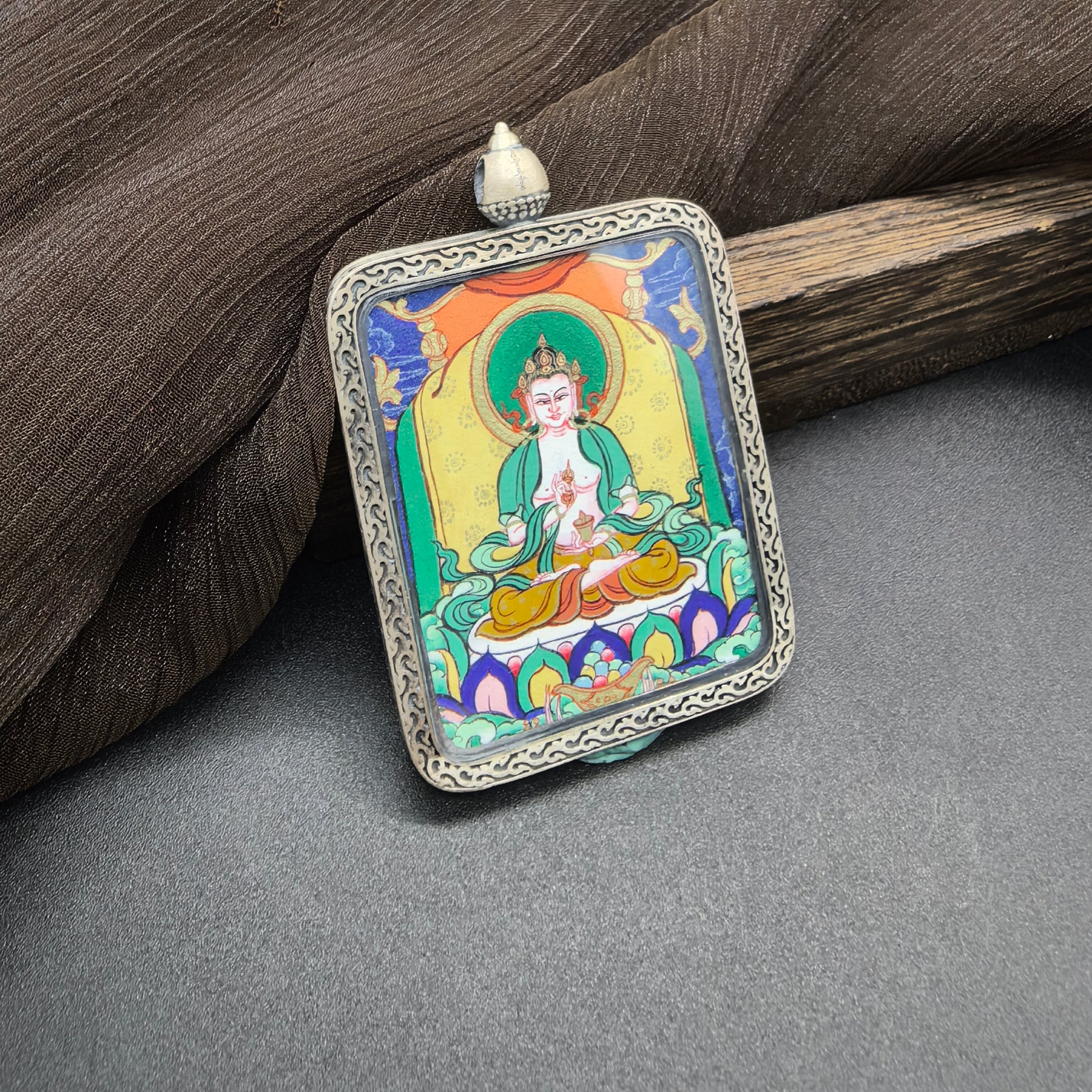  Close-up detail of the Rekong Vajrasattva Thangka painting showing natural mineral pigments and gold, showcasing the masterful artistry of Rekong artists.
