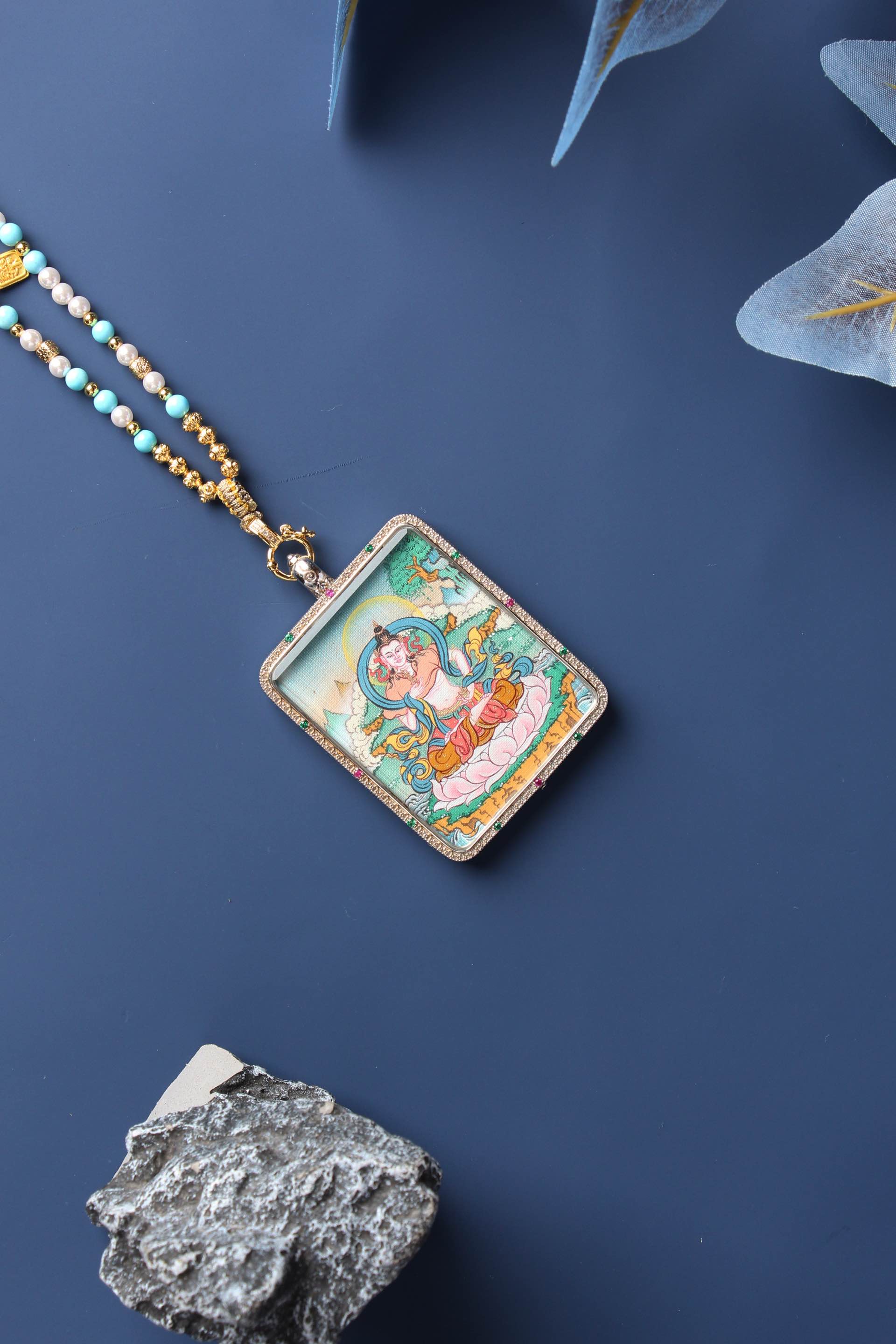 Detailed view of the exclusive 925 Sterling Silver casing for the Vajrasattva Thangka pendant, symbolizing protection and elegance in Tibetan Buddhist tradition.
