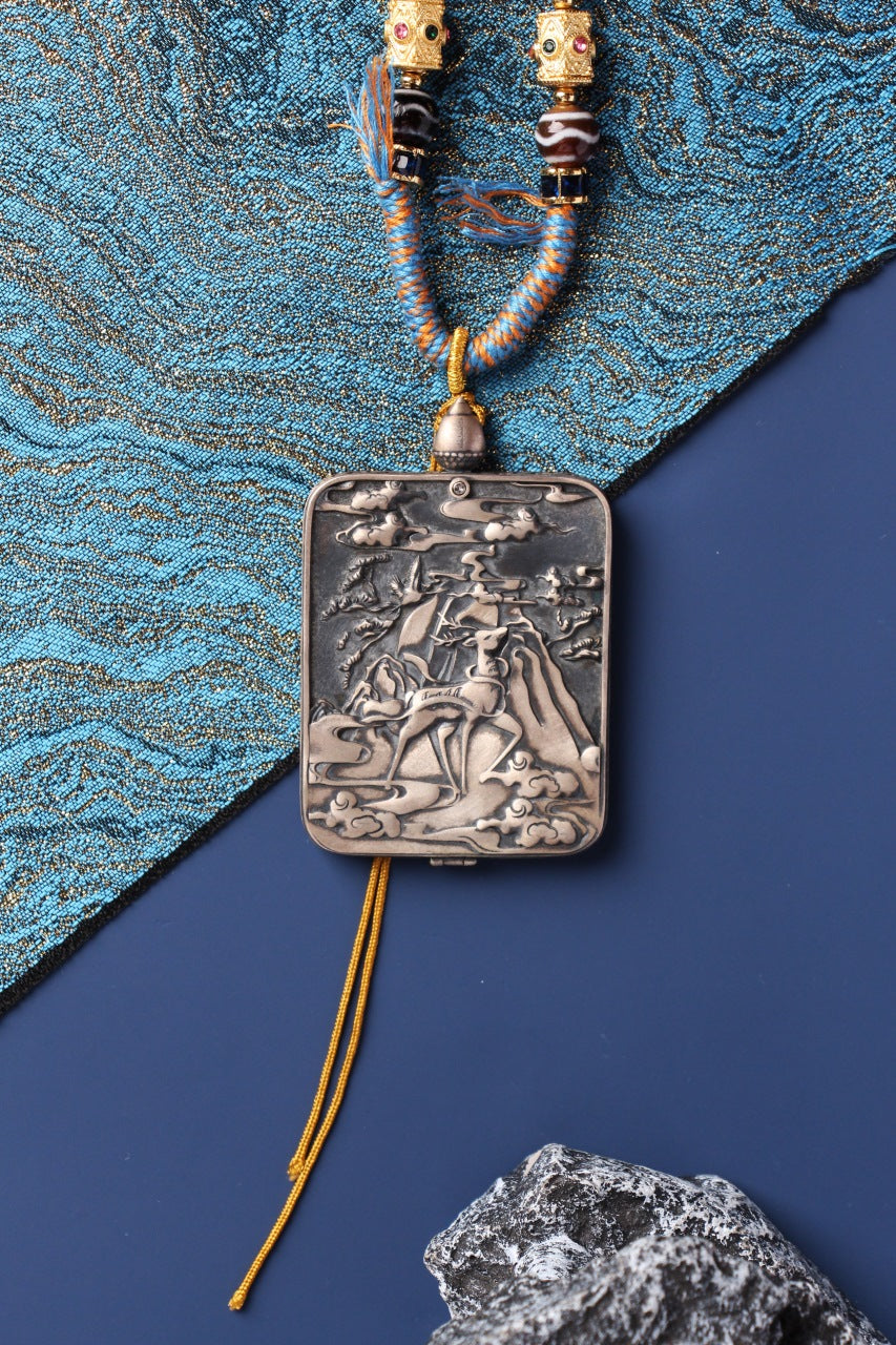 The Tibetan Buddhist Vajrasattva Thangka pendant displayed as a sacred amulet for karma purification, spiritual renewal, and meditation practice, embodying the pure light and compassionate purification of Tibetan Buddhist tradition.

