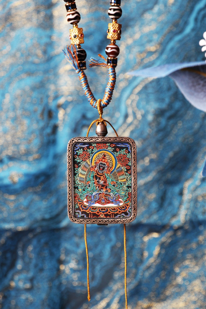 A 3.5x4.5cm hand-painted Tibetan Buddhist Vajrasattva Thangka pendant featuring the Bodhisattva of Purification, encased in exclusive 925 Sterling Silver, representing the purifier of all karma and defilements in Tibetan Buddhist culture.
