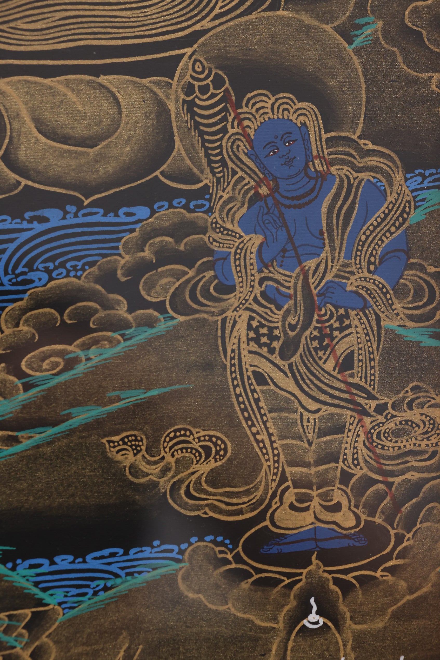A Tibetan Buddhist wealth deity thangka wall decoration, suitable for shrines and home adornment.