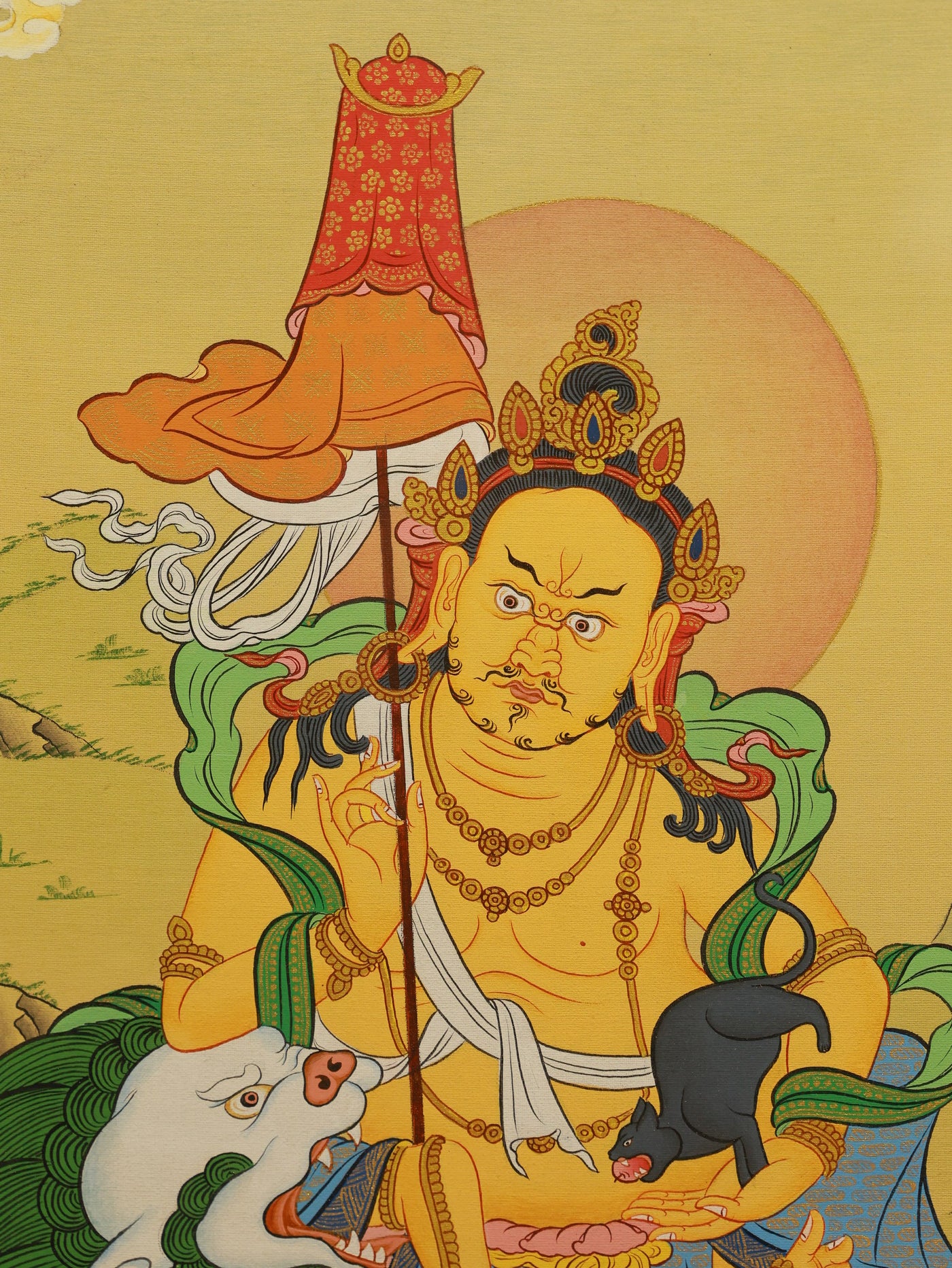 Richly decorated Tibetan Thangka portraying the Treasure Guardian King, emphasizing opulence and spiritual protection.