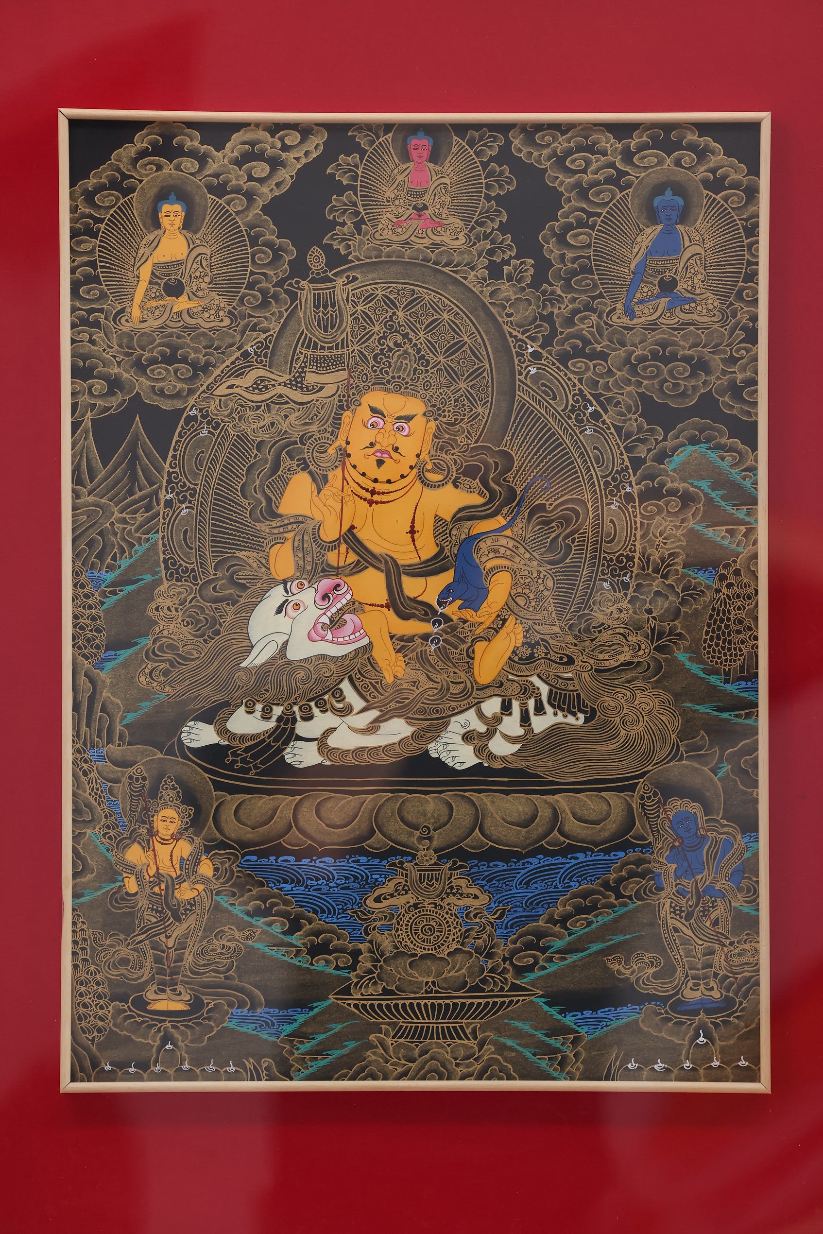 A Tibetan Buddhist Jambhala mandala thangka, displaying the deity's form for offering and prosperity.