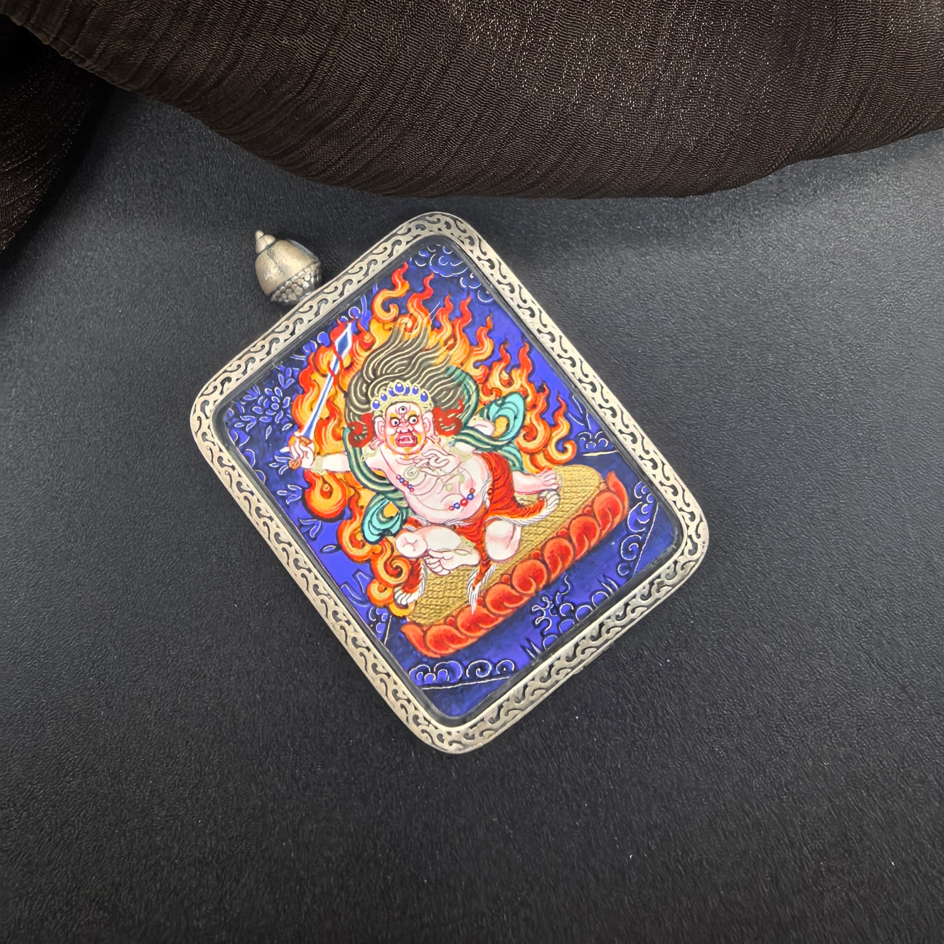  A 3.5x4.5cm hand-painted Rekong Blue Thangka White Acala (白不动明王) Thangka pendant with 925 silver featuring the Immovable One, chief of the five wisdom kings, representing discipline and protection in Buddhist tradition.

