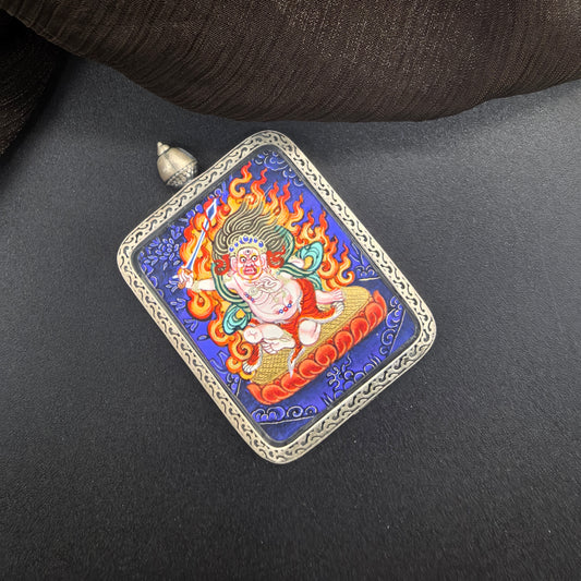  A 3.5x4.5cm hand-painted Rekong Blue Thangka White Acala (白不动明王) Thangka pendant with 925 silver featuring the Immovable One, chief of the five wisdom kings, representing discipline and protection in Buddhist tradition.

