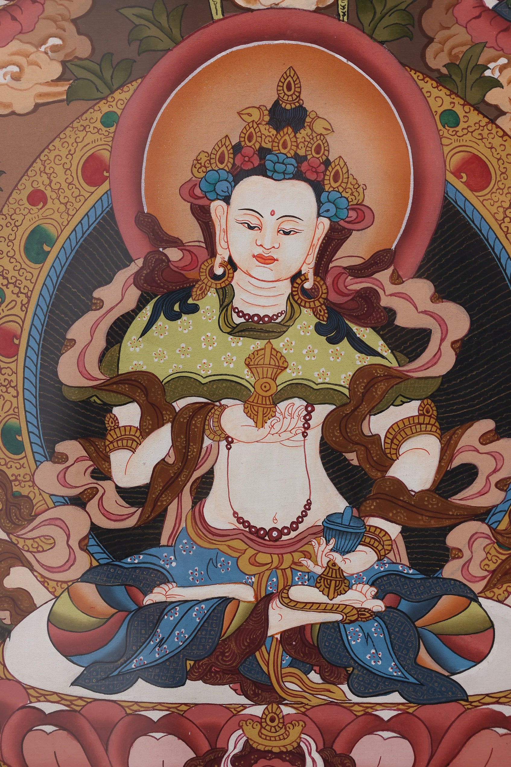 White Tara thangka artwork associated with health, healing rituals, and meditation practice