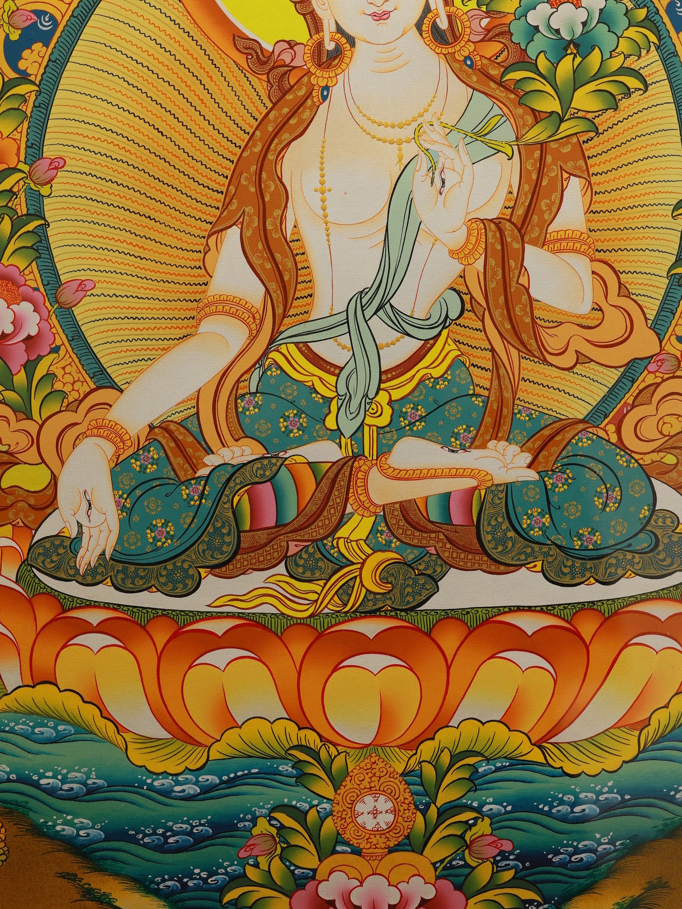 "Handcrafted Tibetan White Tara Thangka, displaying serene expression and intricate floral patterns in rich colors."