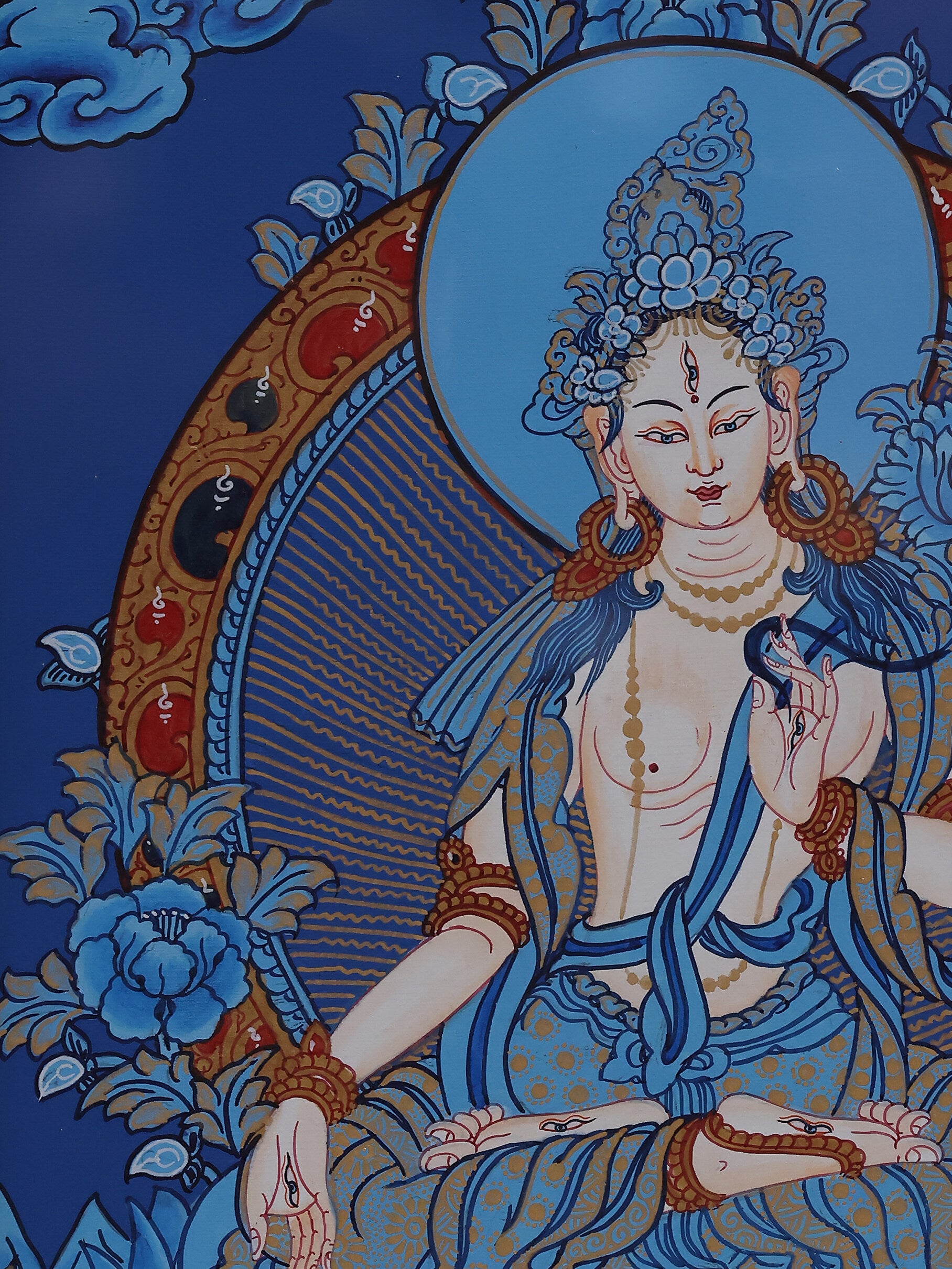 Meditative Blue Thangka artwork of White Tara, expressing wisdom, compassion, and Tibetan Buddhist spiritual energy.