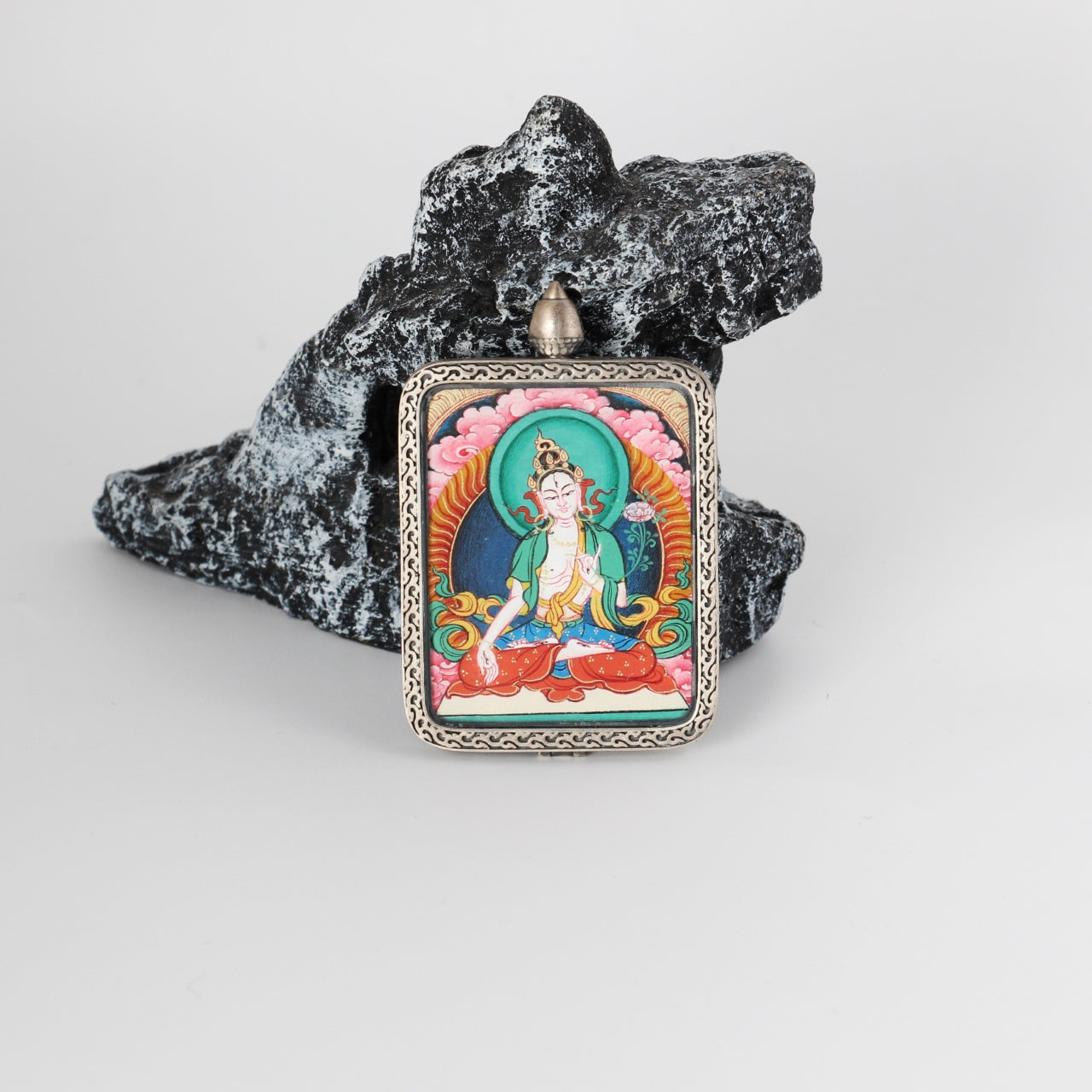  Close-up detail of the Rebgong White Tara Thangka painting showing intricate natural mineral pigment work, showcasing the masterful artistry of Tibetan lineage painters.

