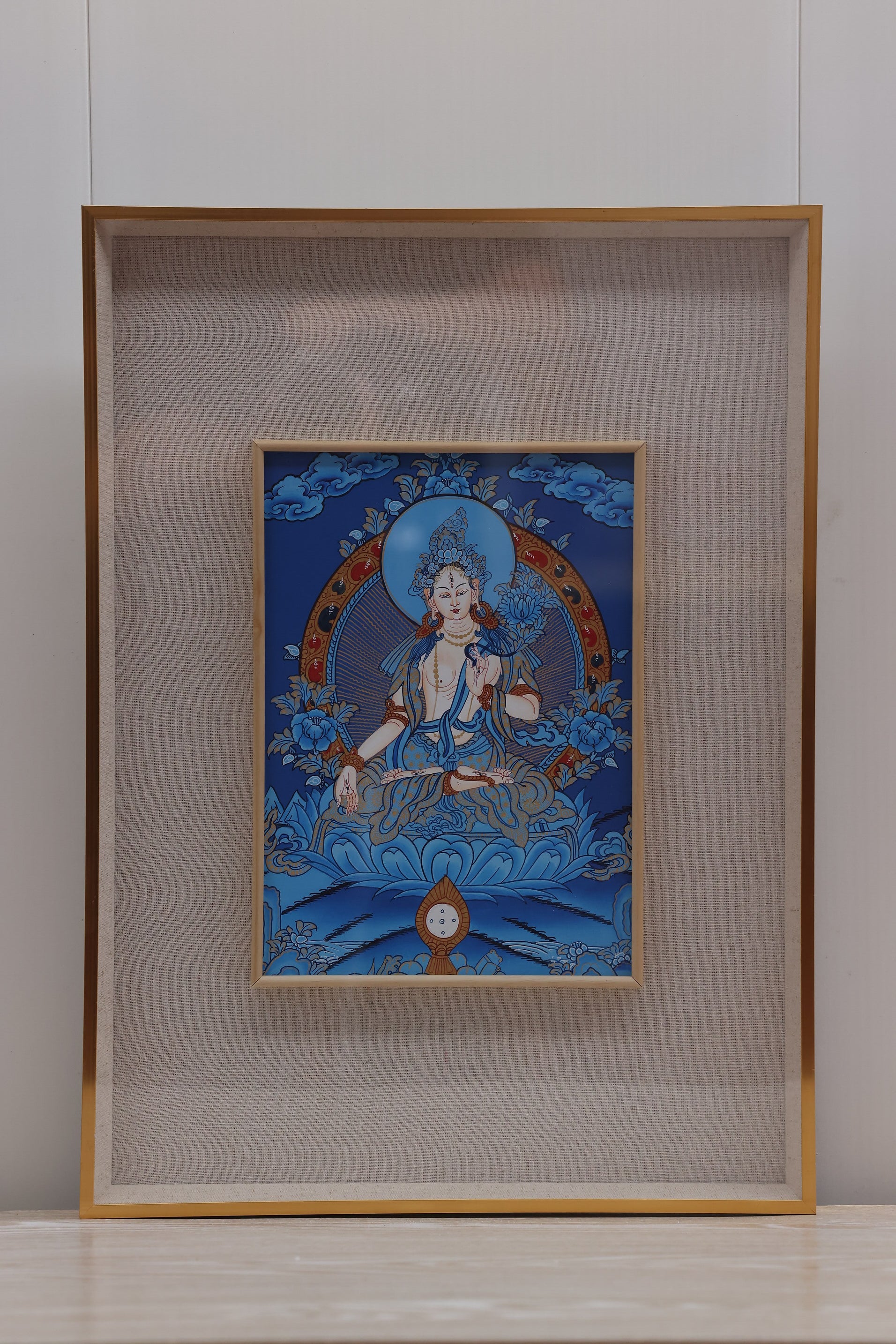 White Tara Thangka on a blue ground, symbolizing healing power, longevity blessings, and inner peace.