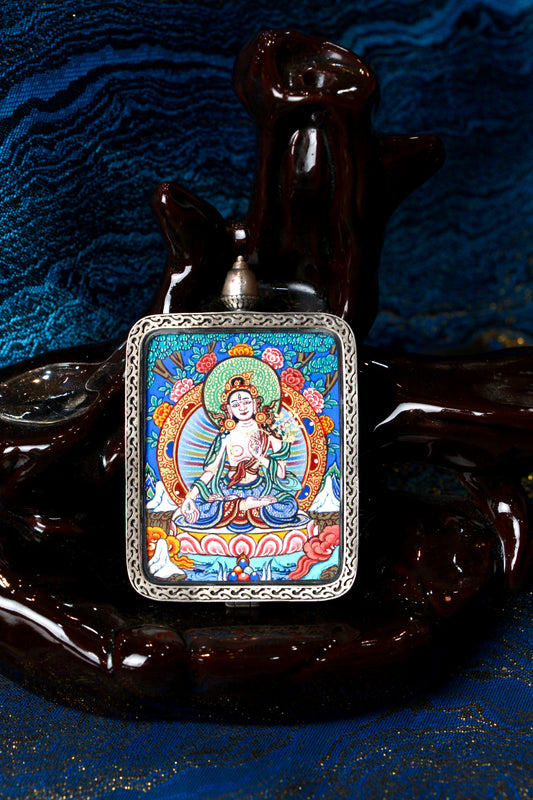 A sacred hand-painted White Tara Thangka pendant from Regong, featuring the goddess of longevity in a fine silver frame.