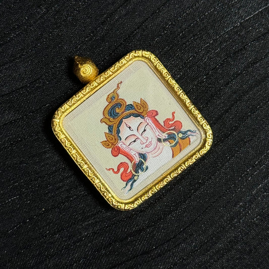  A 2x2cm hand-painted Tibet White Tara Thangka pendant featuring the Longevity and Liberation Buddha Mother, representing longevity and peace in Buddhist tradition.
