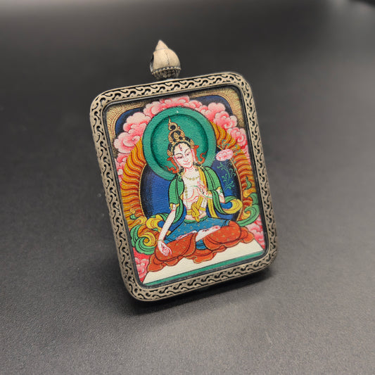 A 3.5x4.5cm hand-painted Tibet Red Cloud White Tara (白度母) Thangka pendant with 925 silver featuring the Tara of Increasing Life, representing longevity and wisdom in Buddhist tradition.
