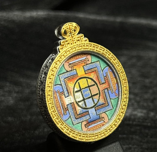 A 2.5x2.5cm hand-painted Tibet Yamantaka (Vajrabhairava) Mandala Thangka pendant featuring the wrathful form of Manjushri, representing wisdom and protection in Buddhist tradition.
