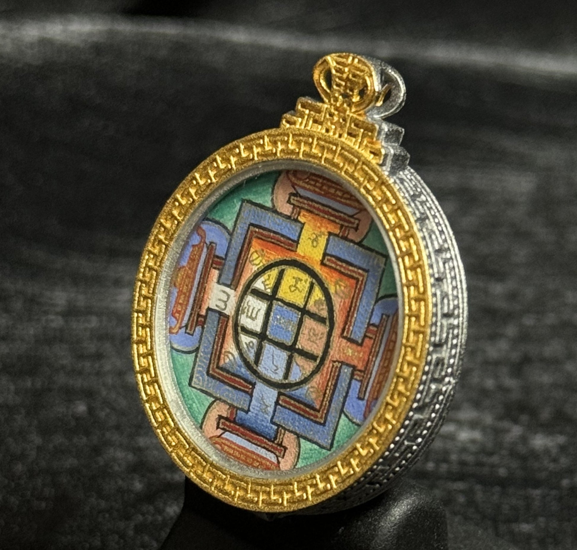 The Tibet Yamantaka Mandala Thangka pendant displayed as a sacred amulet for wisdom and protection, embodying Buddhist tradition.

